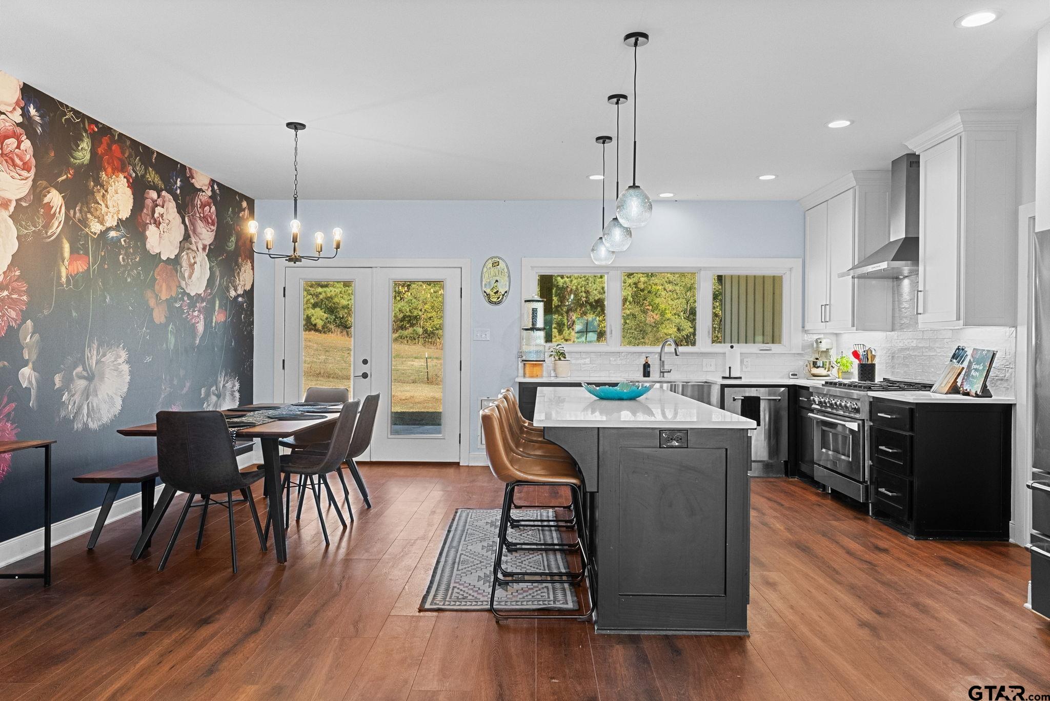10374 Highway 204 Cushing, TX 75760 - Photo 6 of 28 a view of a dining room with furniture window and wooden floor