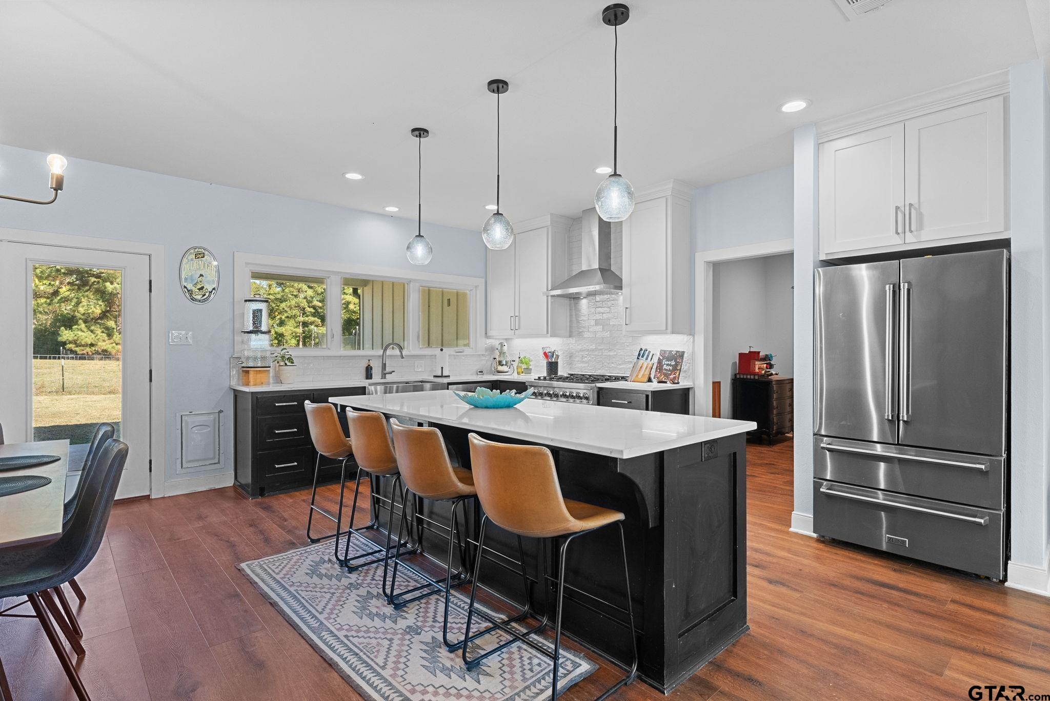 10374 Highway 204 Cushing, TX 75760 - Photo 7 of 28 a large kitchen with a table and chairs