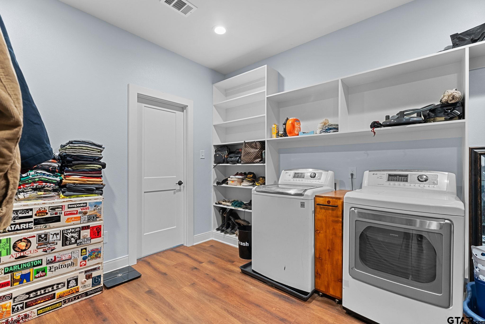 10374 Highway 204 Cushing, TX 75760 - Photo 8 of 28 a view of storage and utility room with washer and dryer