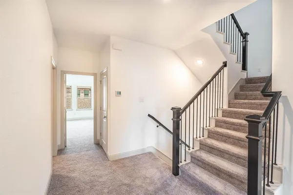 a view of a hallway with staircase
