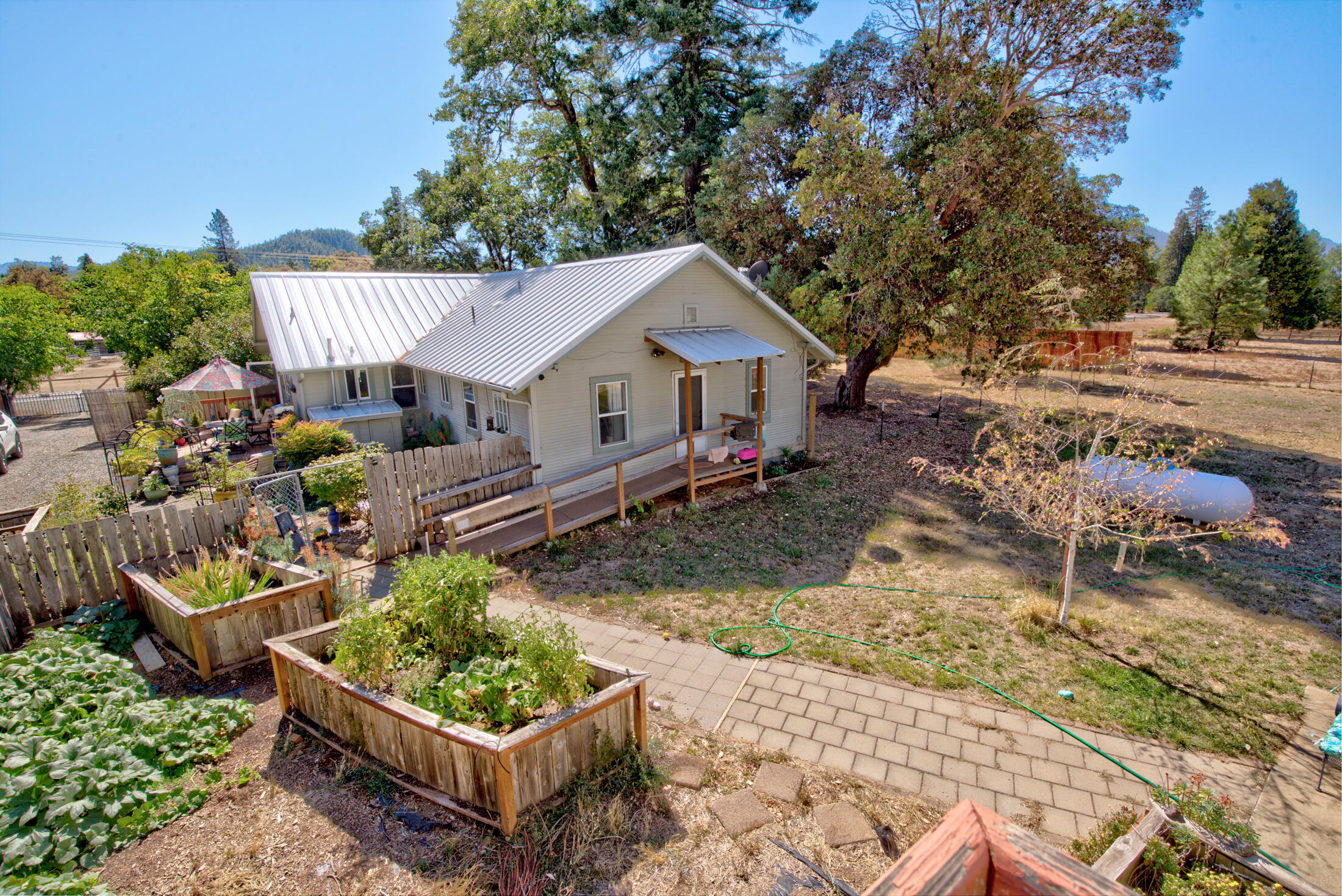 800 Deer Creek Road Selma, OR 97538 - Photo 5 of 42 Rear View of Main Home, Garden, Fenced Area For Pets