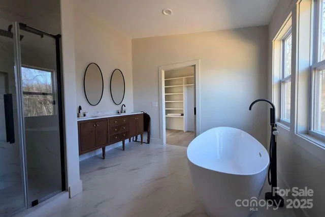 a view of a livingroom with furniture and a window