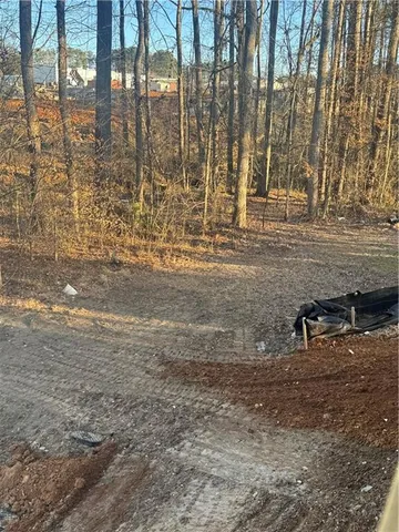 a view of a backyard of the house