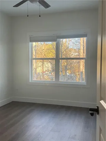 a view of an empty room with a window