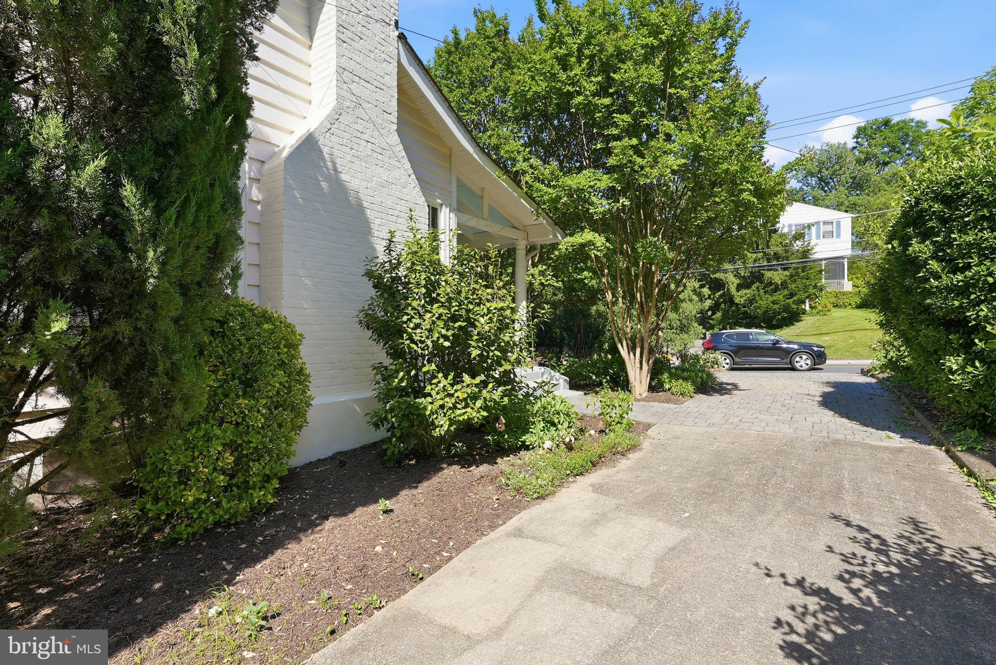 6814 Brookville Road Chevy Chase, MD 20815 - Photo 39 of 39 Lush greenery frames a welcoming drive.