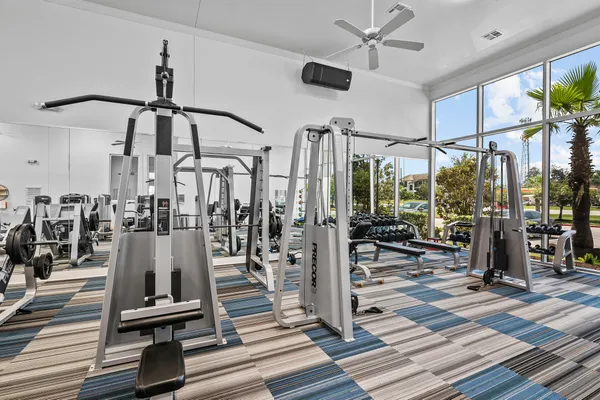 a living room with patio furniture and a flat screen tv