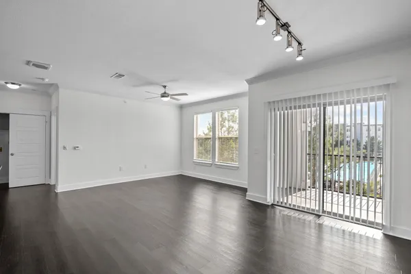 a large kitchen with a lot of counter space and a refrigerator