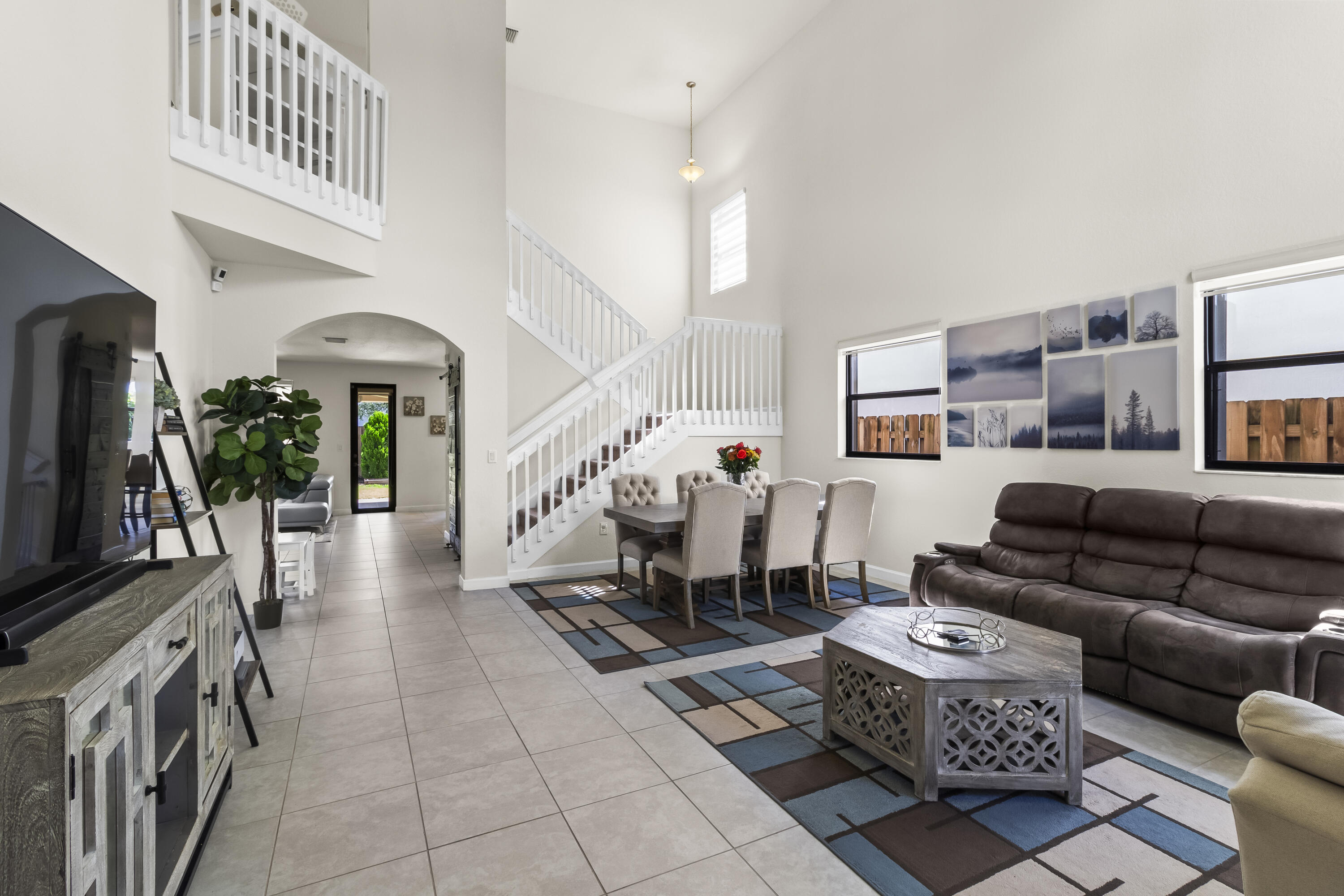 11823 Southwest 151st Place Miami, FL 33196 - Photo 2 of 53 a living room with furniture and a flat screen tv