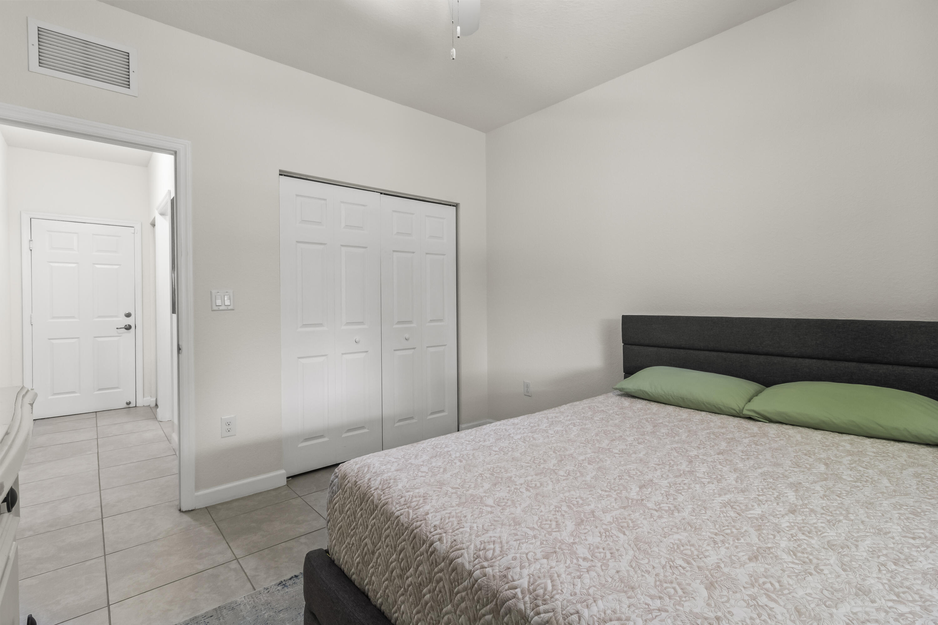 11823 Southwest 151st Place Miami, FL 33196 - Photo 22 of 53 a bedroom with a bed and a shower