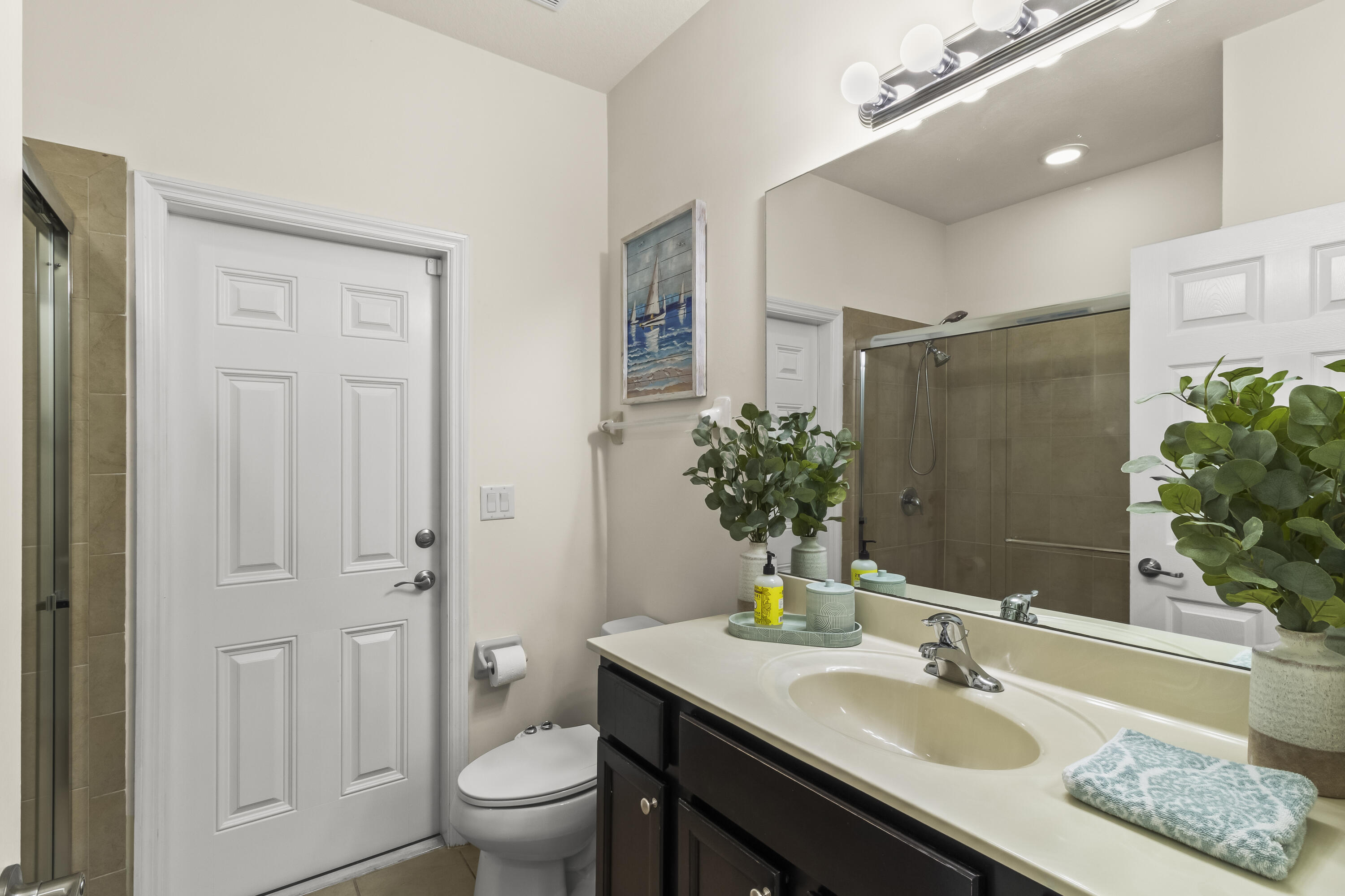 11823 Southwest 151st Place Miami, FL 33196 - Photo 23 of 53 a bathroom with a granite countertop sink toilet and shower