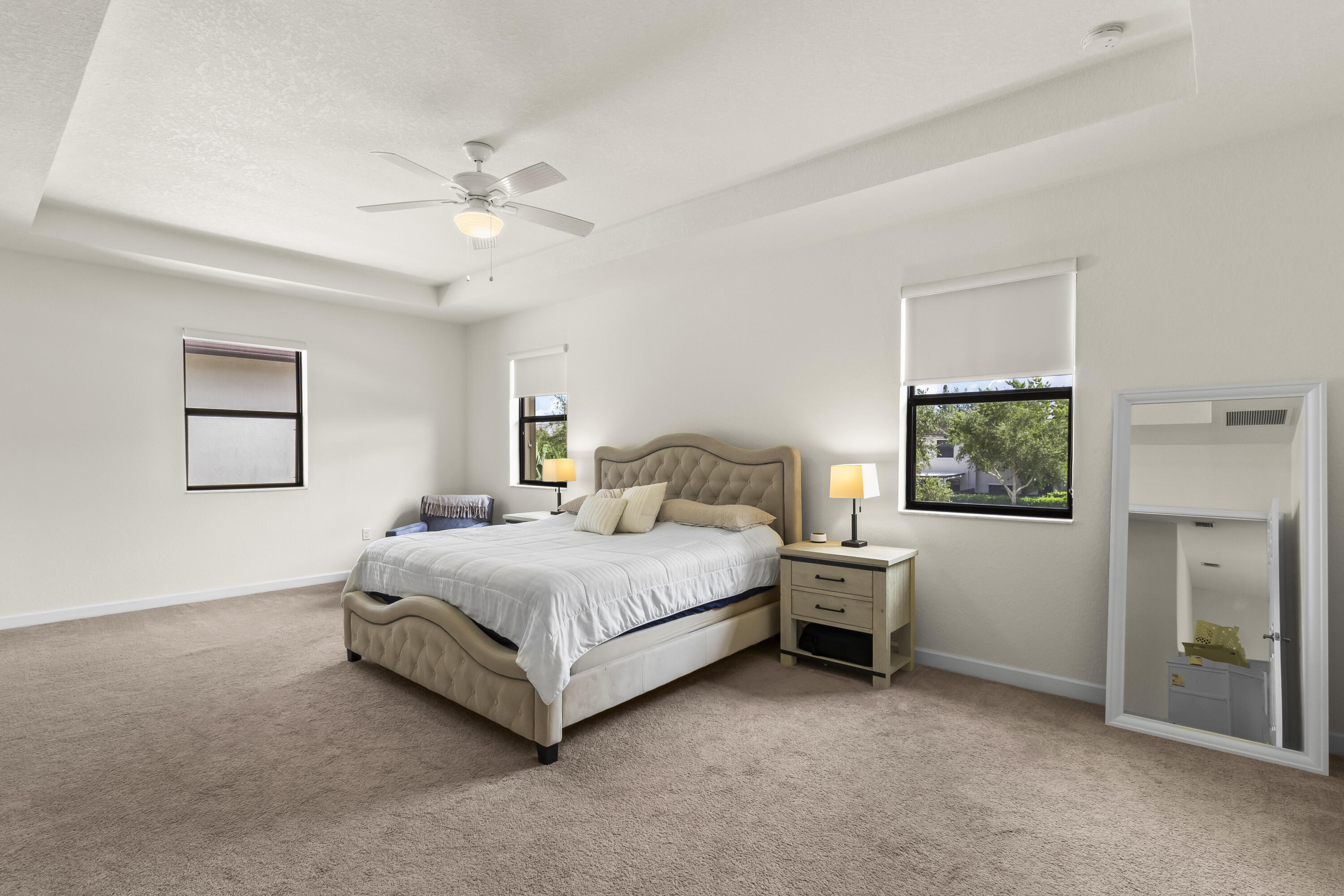 11823 Southwest 151st Place Miami, FL 33196 - Photo 28 of 53 a spacious bedroom with a bed and a window