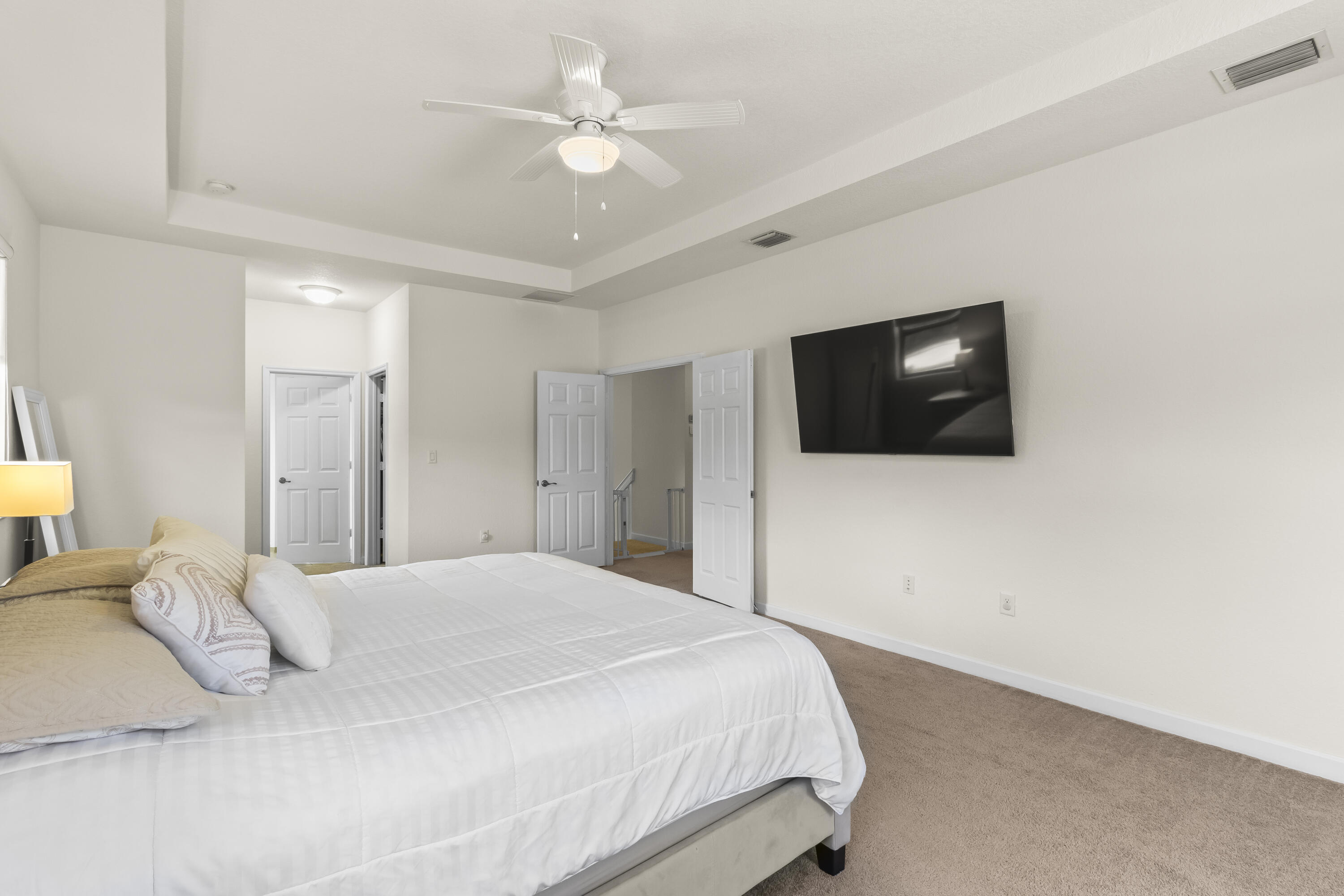 11823 Southwest 151st Place Miami, FL 33196 - Photo 30 of 53 a bedroom with a bed and a flat screen tv