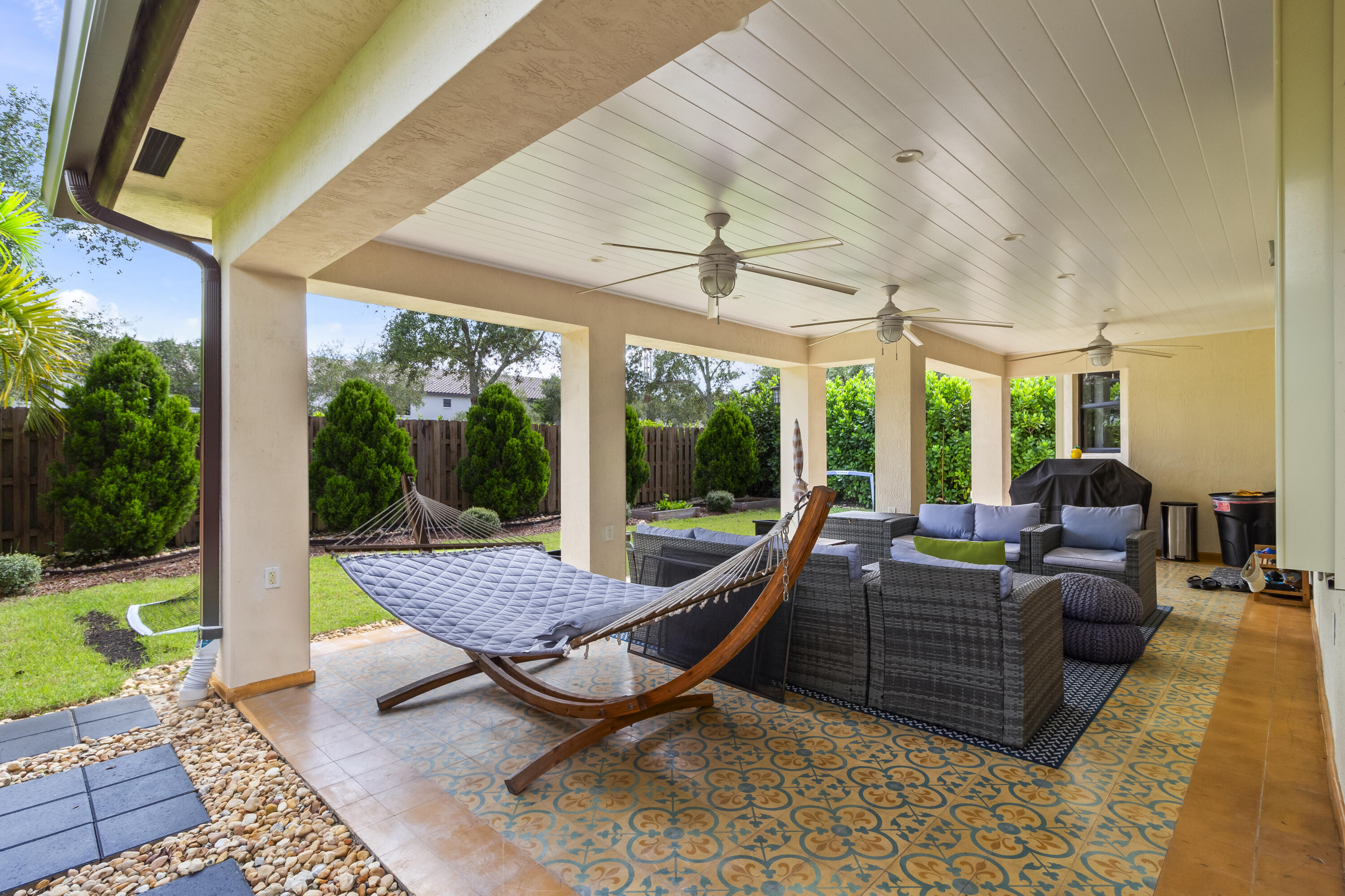 11823 Southwest 151st Place Miami, FL 33196 - Photo 3 of 53 a outdoor space with patio the couches and pool