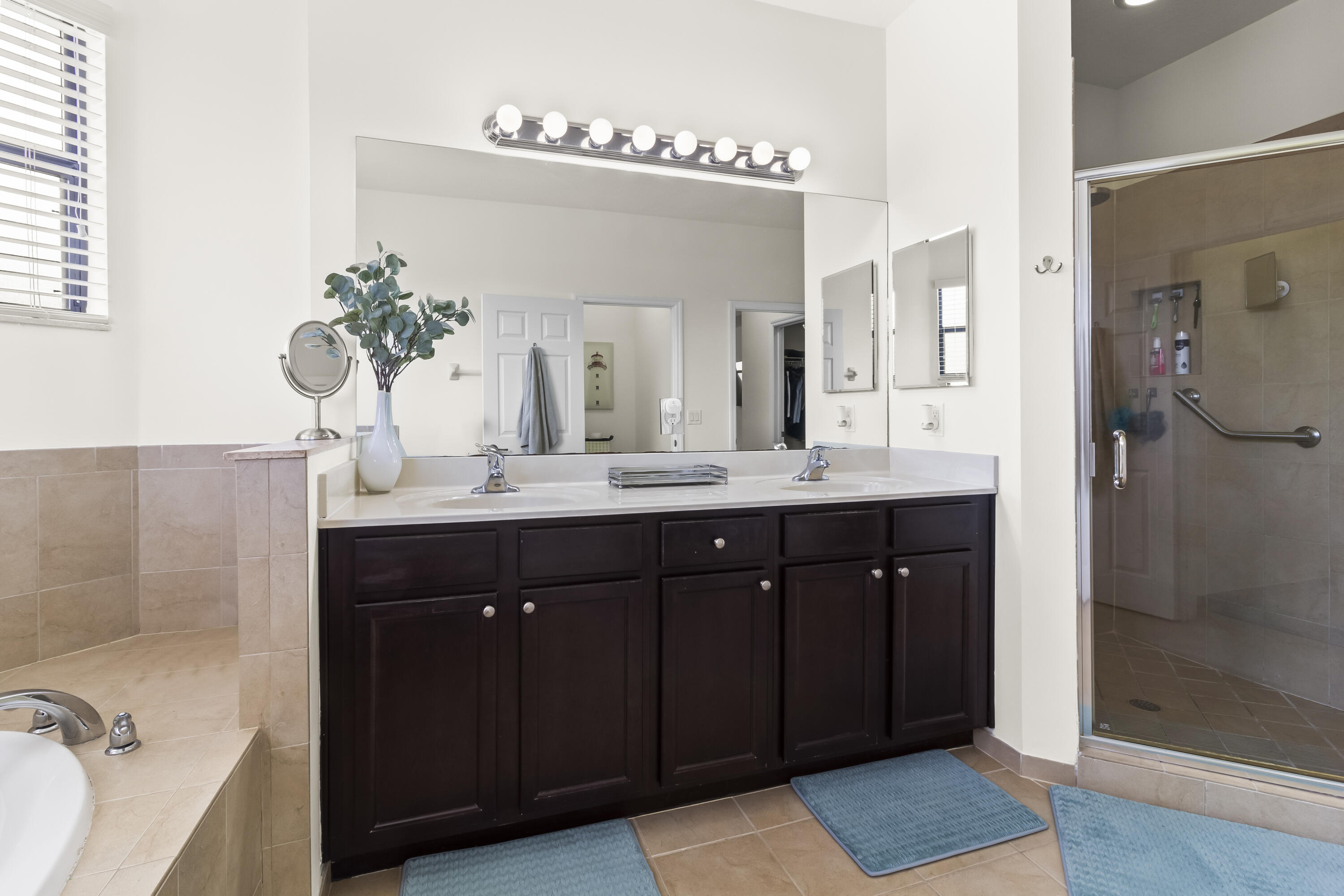 11823 Southwest 151st Place Miami, FL 33196 - Photo 34 of 53 a bathroom with a double vanity sink mirror and shower