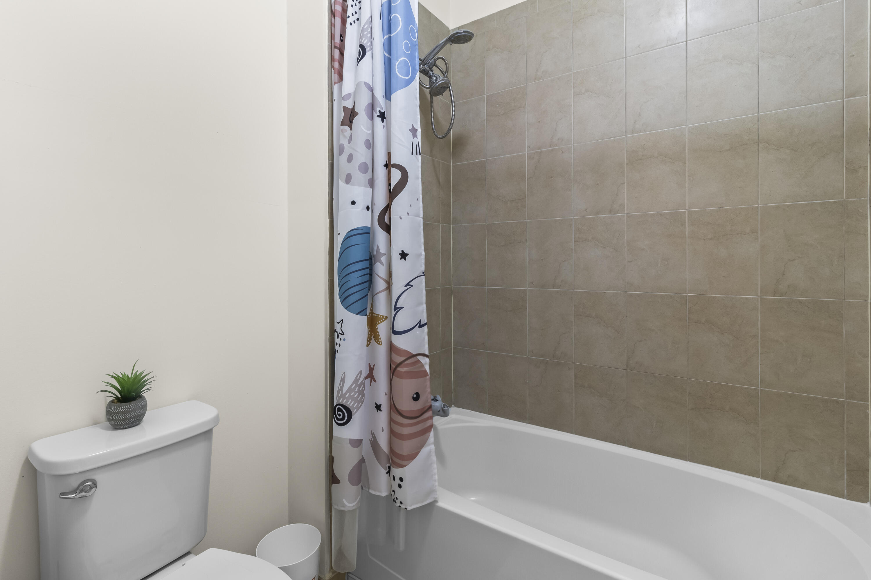 11823 Southwest 151st Place Miami, FL 33196 - Photo 37 of 53 a bath room with a toilet and a bath tub