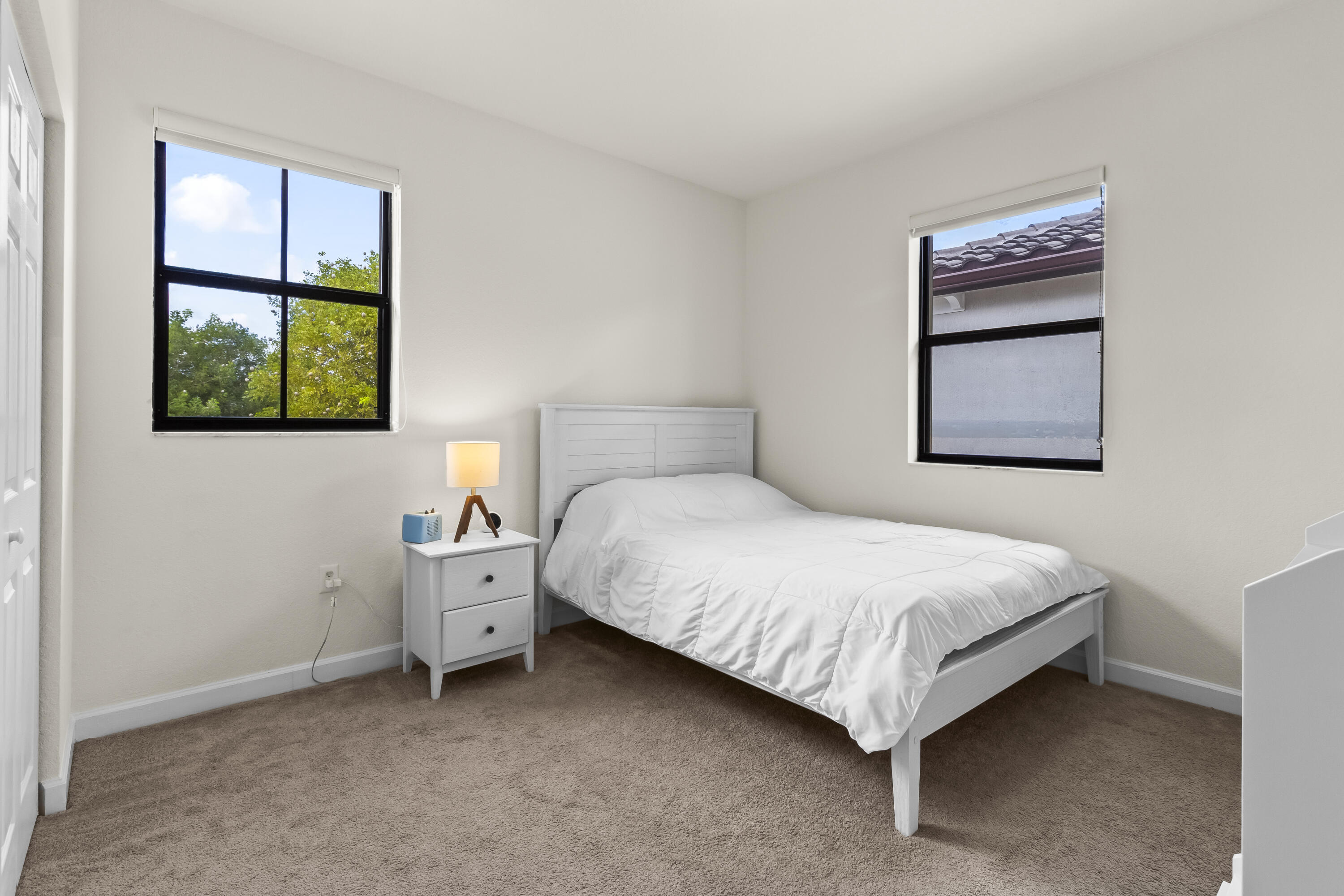 11823 Southwest 151st Place Miami, FL 33196 - Photo 38 of 53 a bedroom with a bed and a window