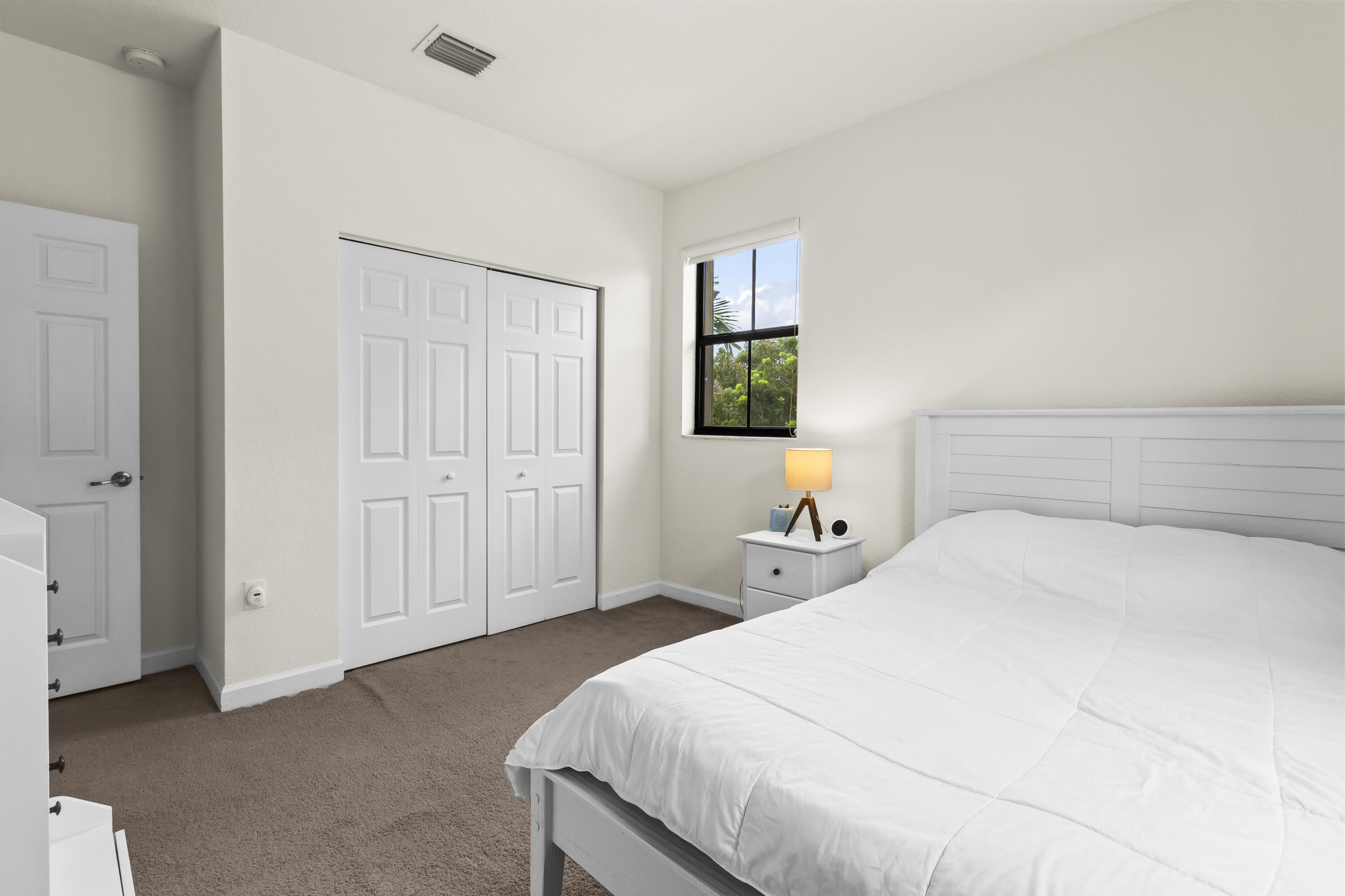 11823 Southwest 151st Place Miami, FL 33196 - Photo 39 of 53 a bedroom with a bed and a potted plant