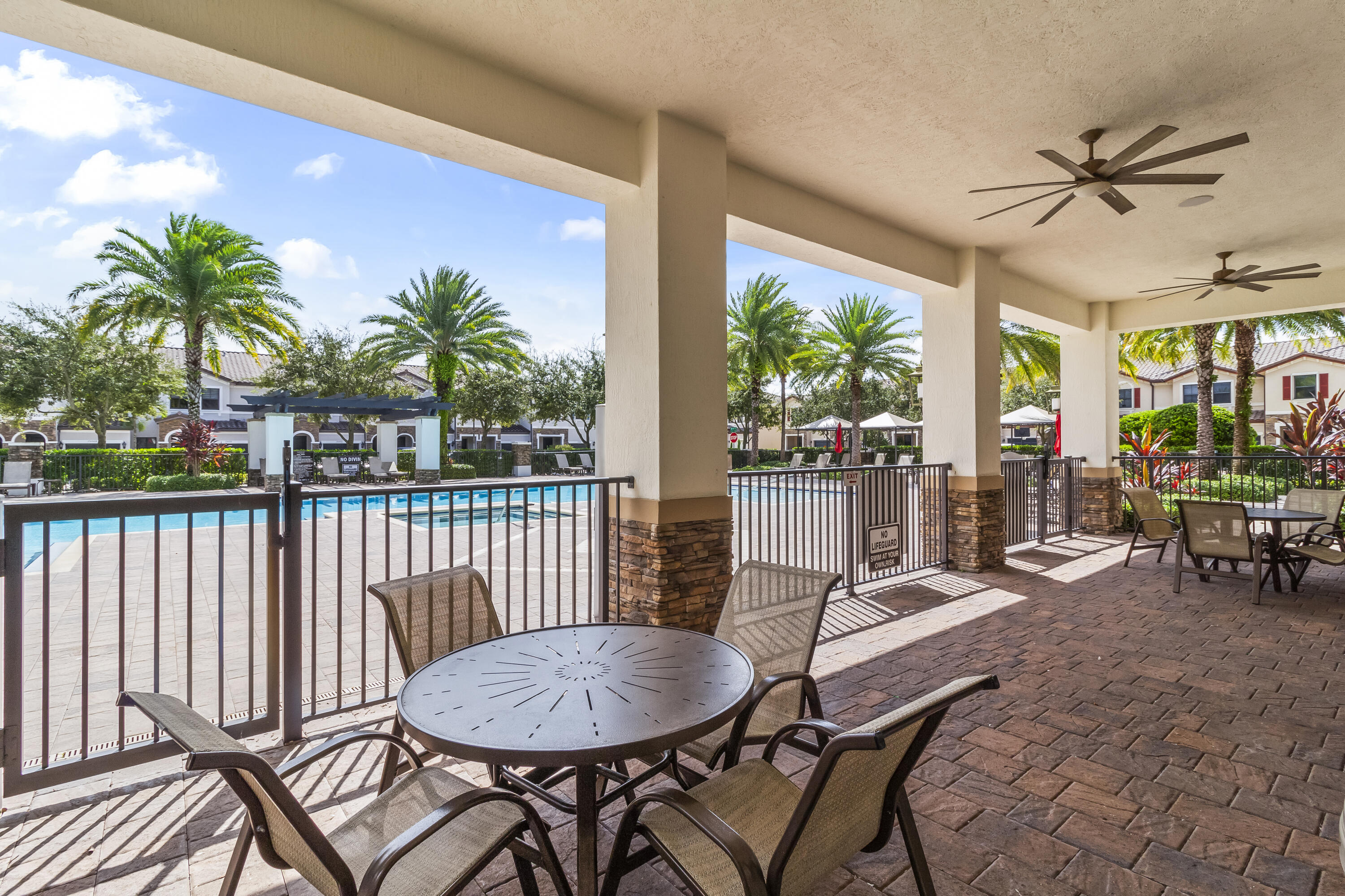 11823 Southwest 151st Place Miami, FL 33196 - Photo 46 of 53 a view of a balcony with furniture and a floor to ceiling window