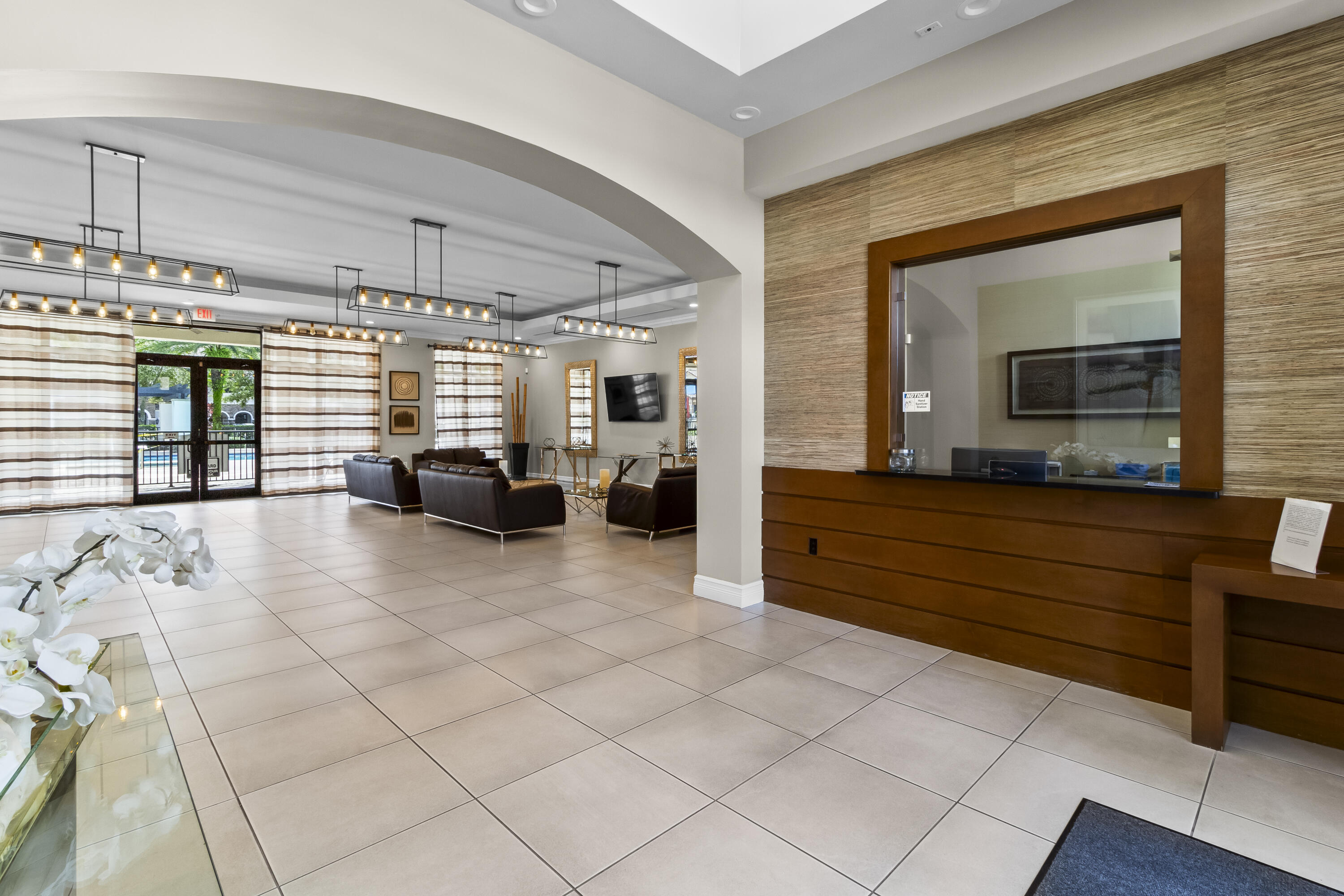 11823 Southwest 151st Place Miami, FL 33196 - Photo 49 of 53 a living room with furniture a large window and kitchen view