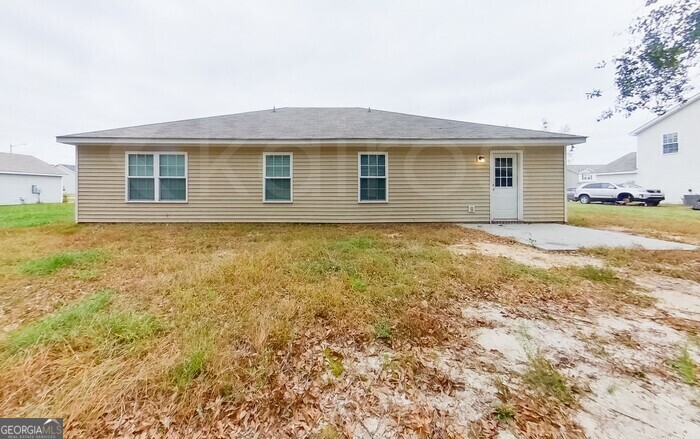 231 Western Red Cedar Drive Springfield, GA 31329 - Photo 24 of 26 a view of a house with a yard