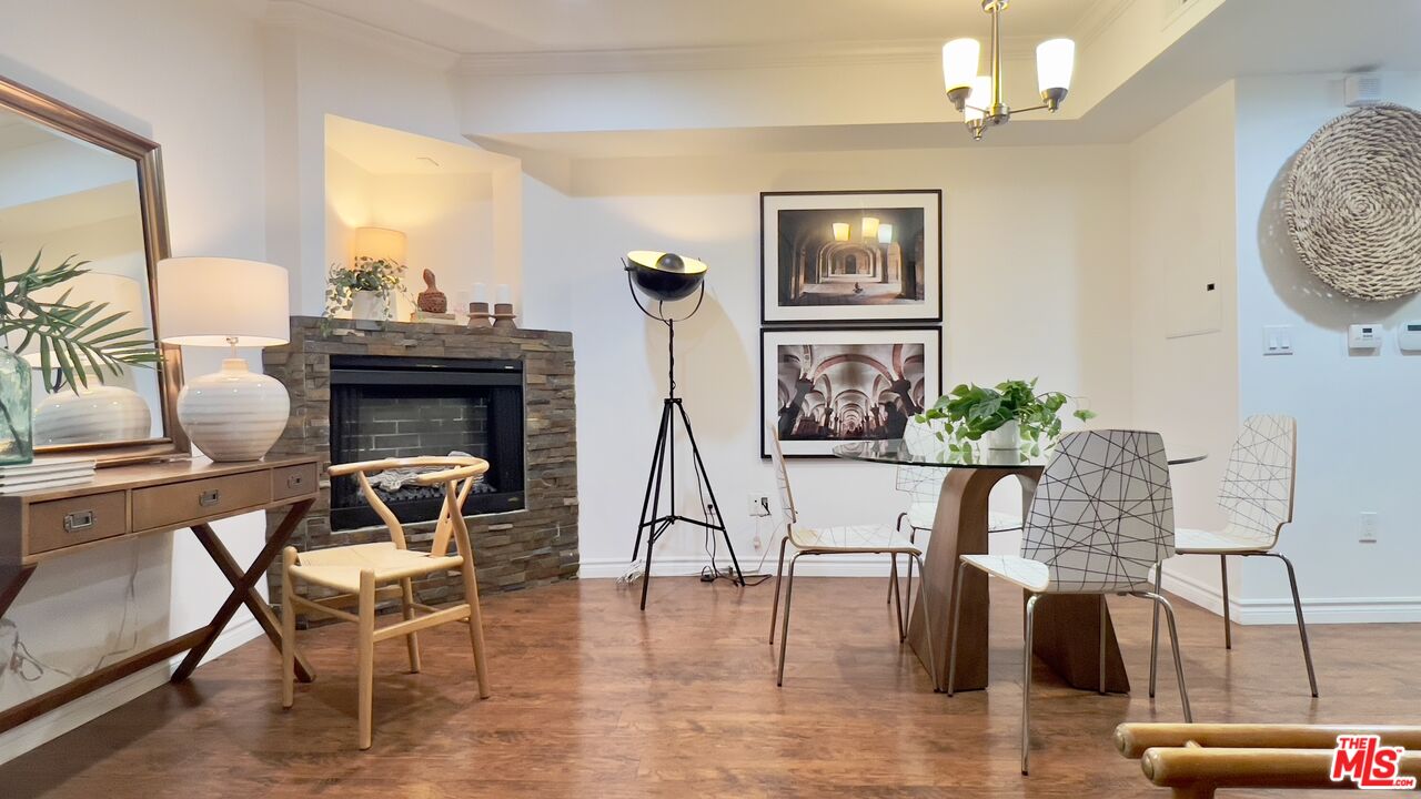 5633 Carlton Way, Unit 203 Los Angeles, CA 90028 - Photo 2 of 15 a view of a livingroom with furniture and a potted plant