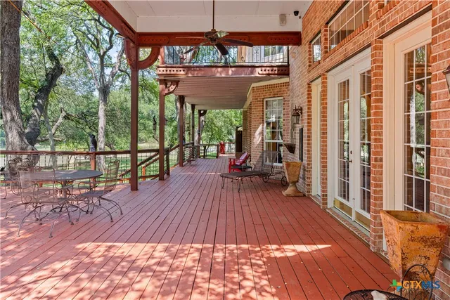 a view of a chairs and table on the wooden floor