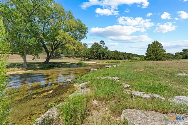 a view of a lake with a big yard
