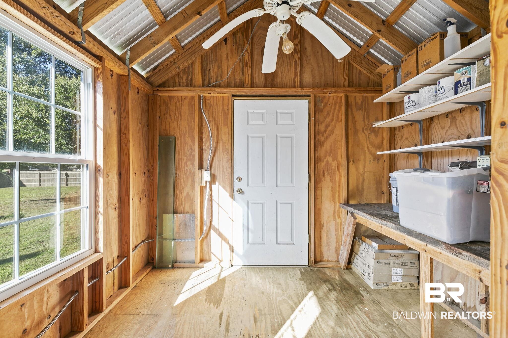 9631 Bay Meadows Avenue Fairhope, AL 36532 - Photo 33 of 49 Door leading to back yard. Storage with ceiling fan.
