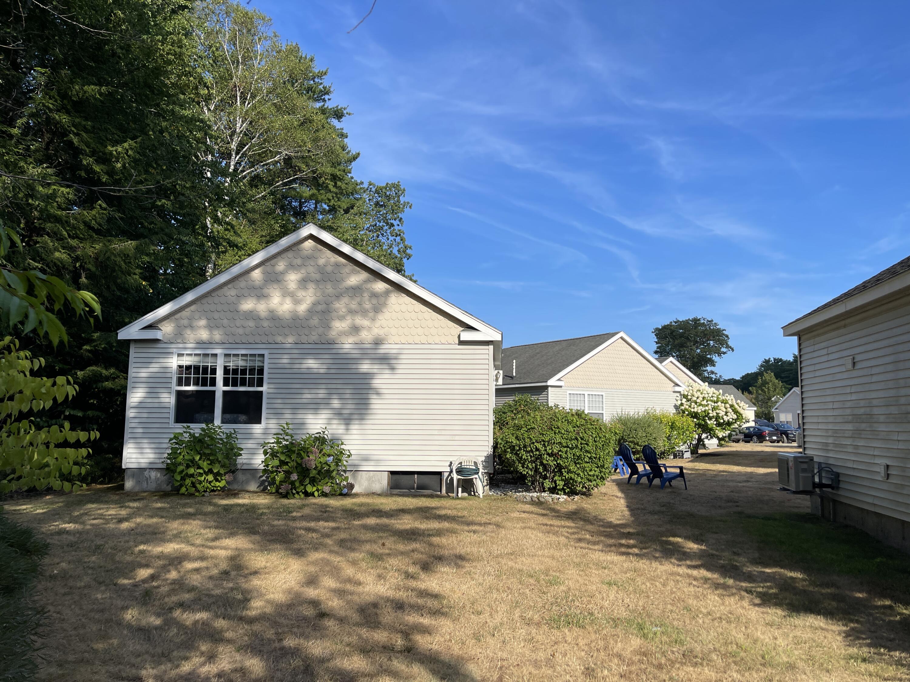412 Post Road, Unit 127 Wells, ME 04090 - Photo 24 of 38 Side yard