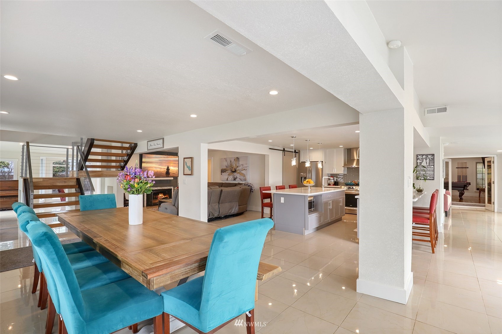 7031 Mullen Road Southeast Olympia, WA 98503 - Photo 12 of 40 a view of a dining room kitchen with furniture and wooden floor