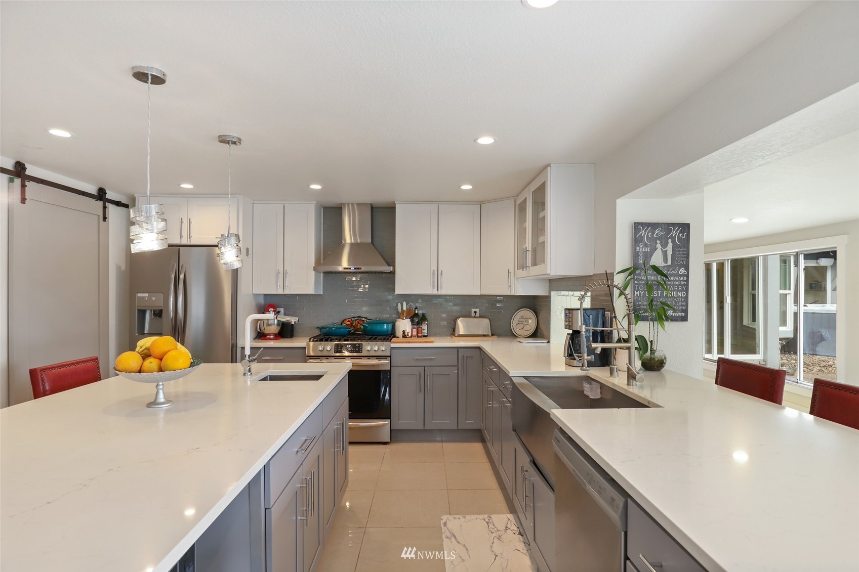 7031 Mullen Road Southeast Olympia, WA 98503 - Photo 15 of 40 a kitchen with a sink a stove and cabinets
