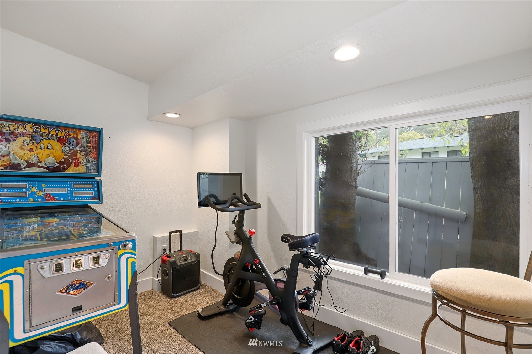 7031 Mullen Road Southeast Olympia, WA 98503 - Photo 21 of 40 a room with gym equipment and a flat screen tv