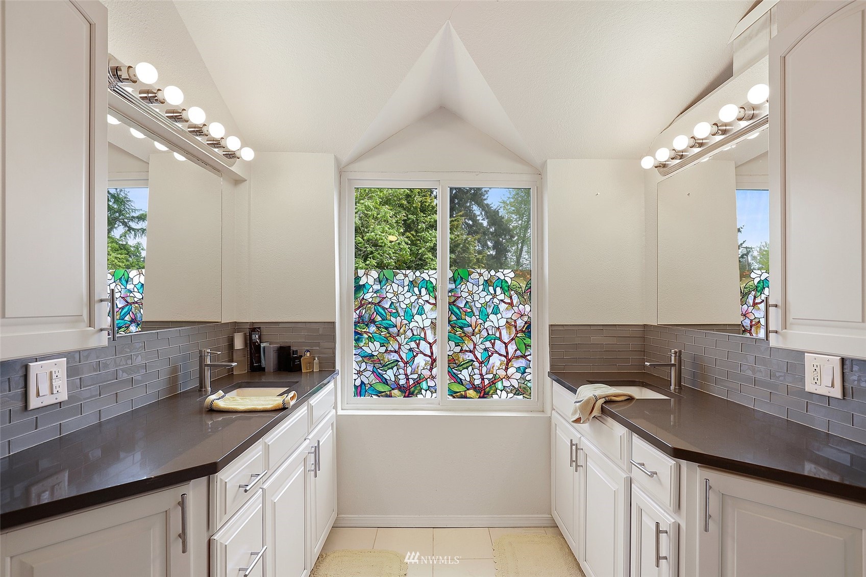 7031 Mullen Road Southeast Olympia, WA 98503 - Photo 25 of 40 a kitchen with a sink stove and cabinets
