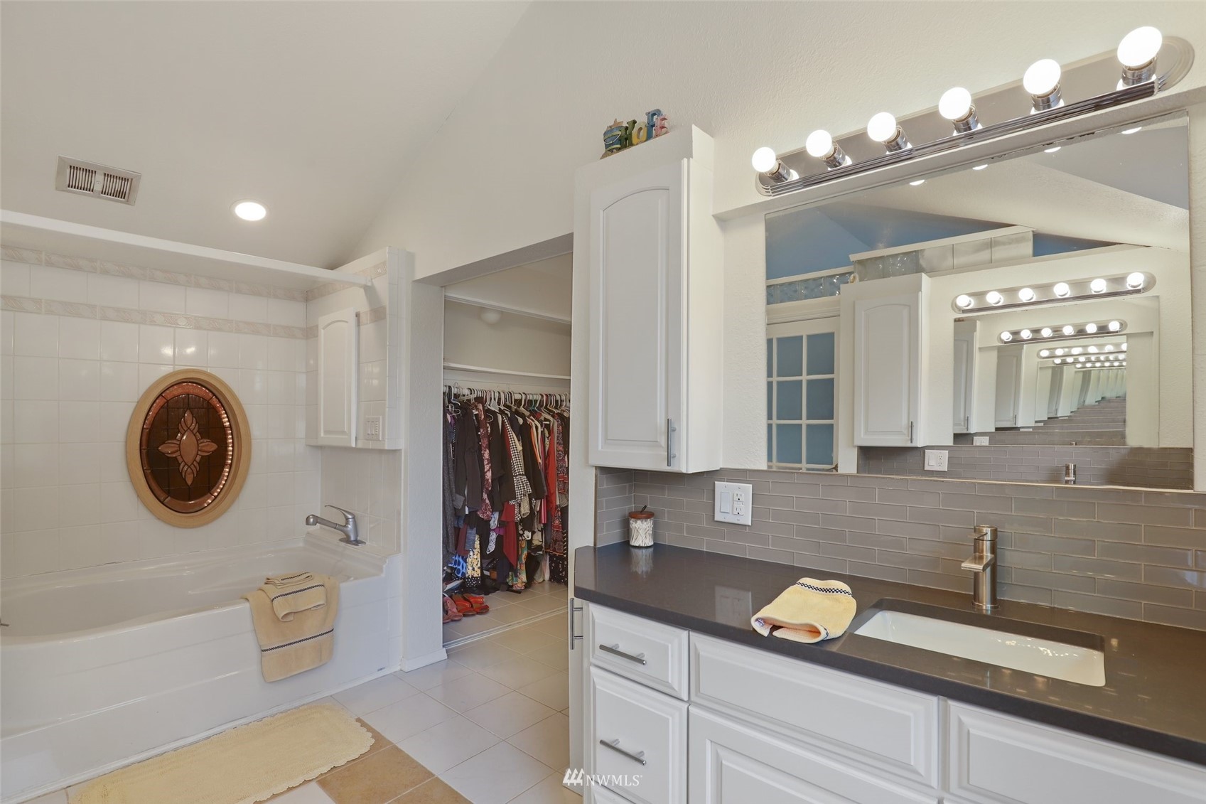 7031 Mullen Road Southeast Olympia, WA 98503 - Photo 26 of 40 a spacious bathroom with a sink a mirror and a shower