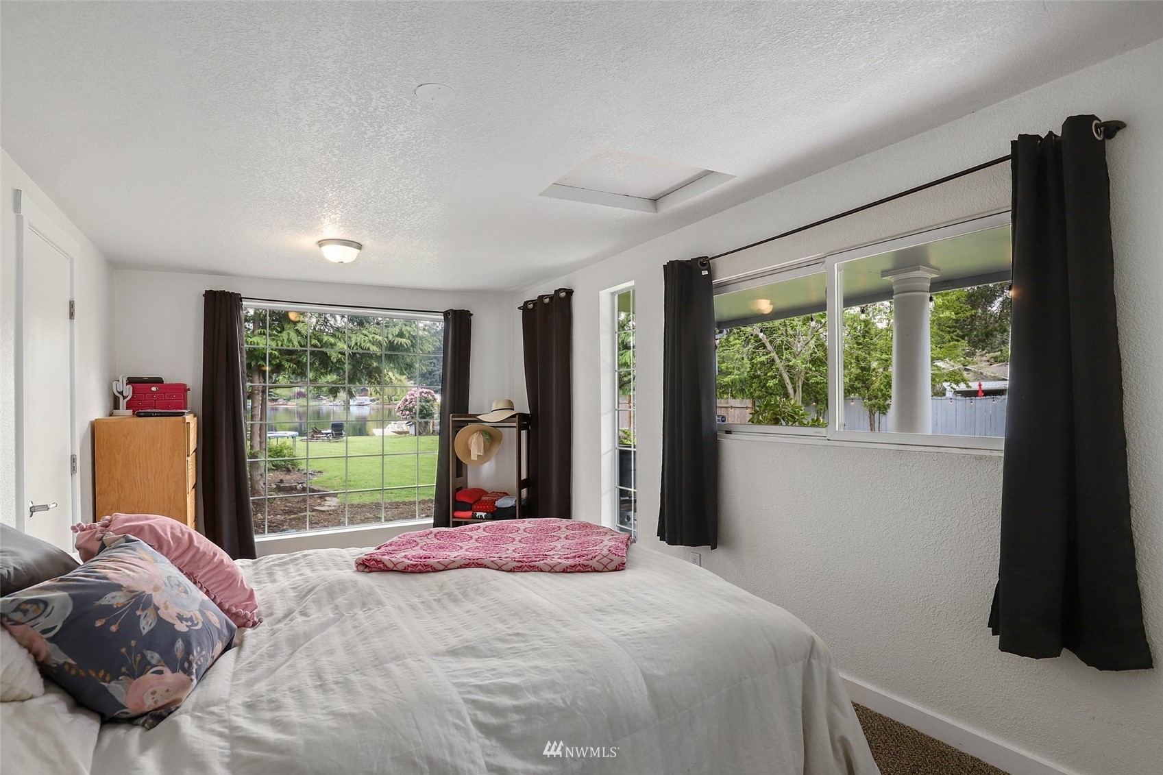 7031 Mullen Road Southeast Olympia, WA 98503 - Photo 27 of 40 a bedroom with a bed and a large window