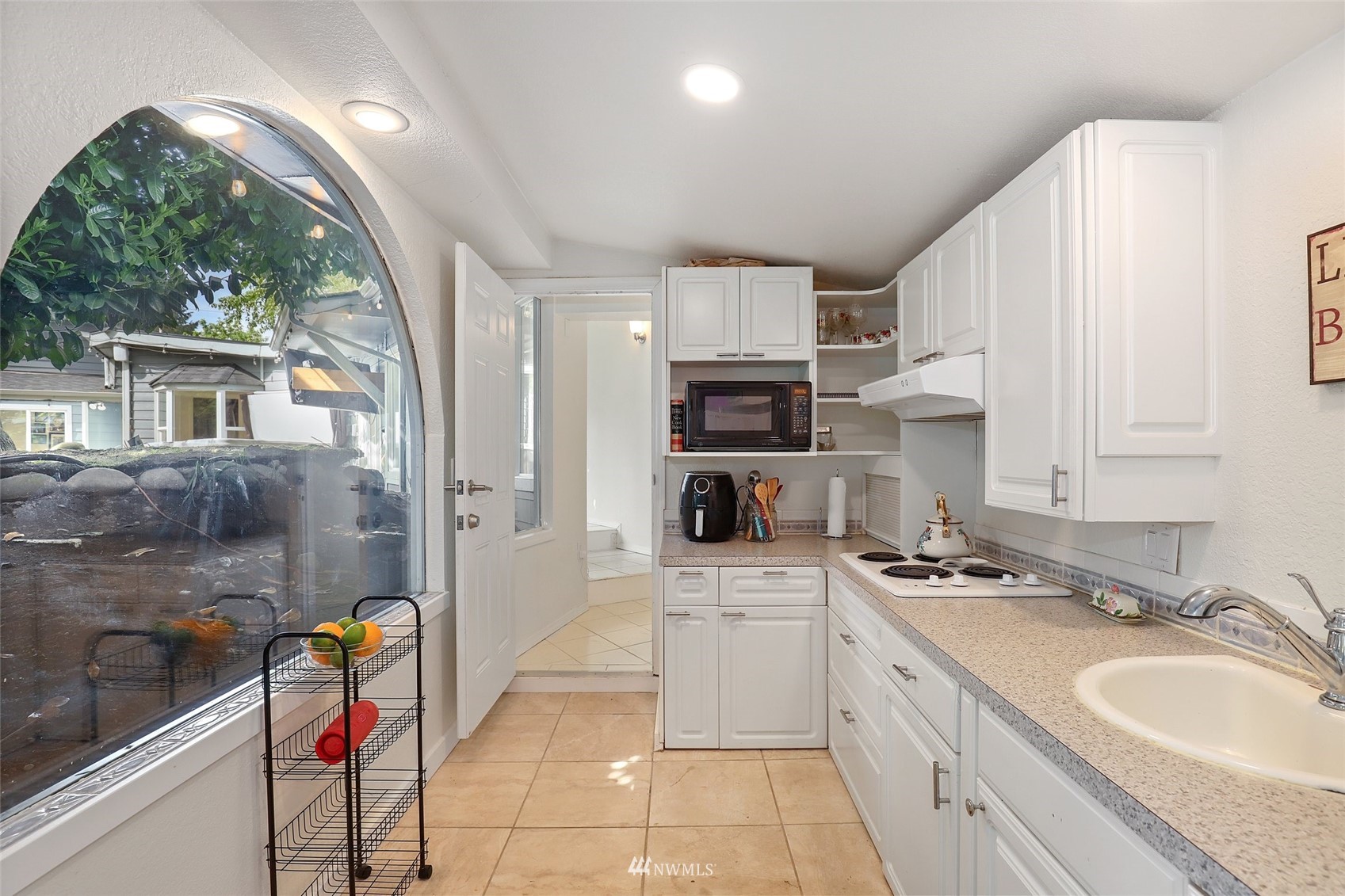 7031 Mullen Road Southeast Olympia, WA 98503 - Photo 32 of 40 a kitchen that has a lot of cabinets in it and appliances