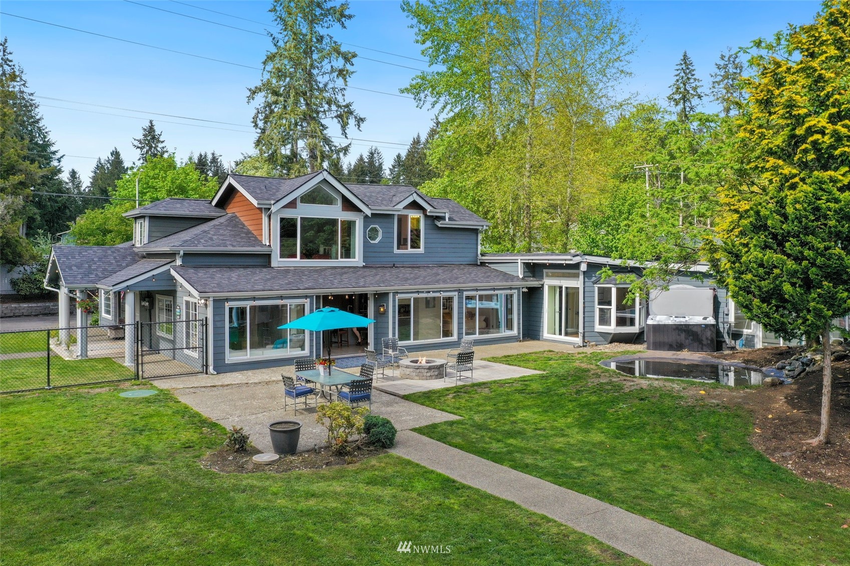 7031 Mullen Road Southeast Olympia, WA 98503 - Photo 33 of 40 a front view of a house with a garden and trees
