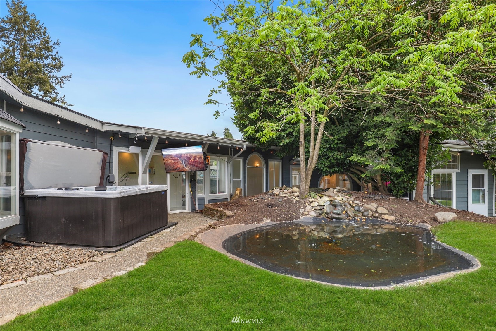 7031 Mullen Road Southeast Olympia, WA 98503 - Photo 36 of 40 a view of a house with backyard and sitting area