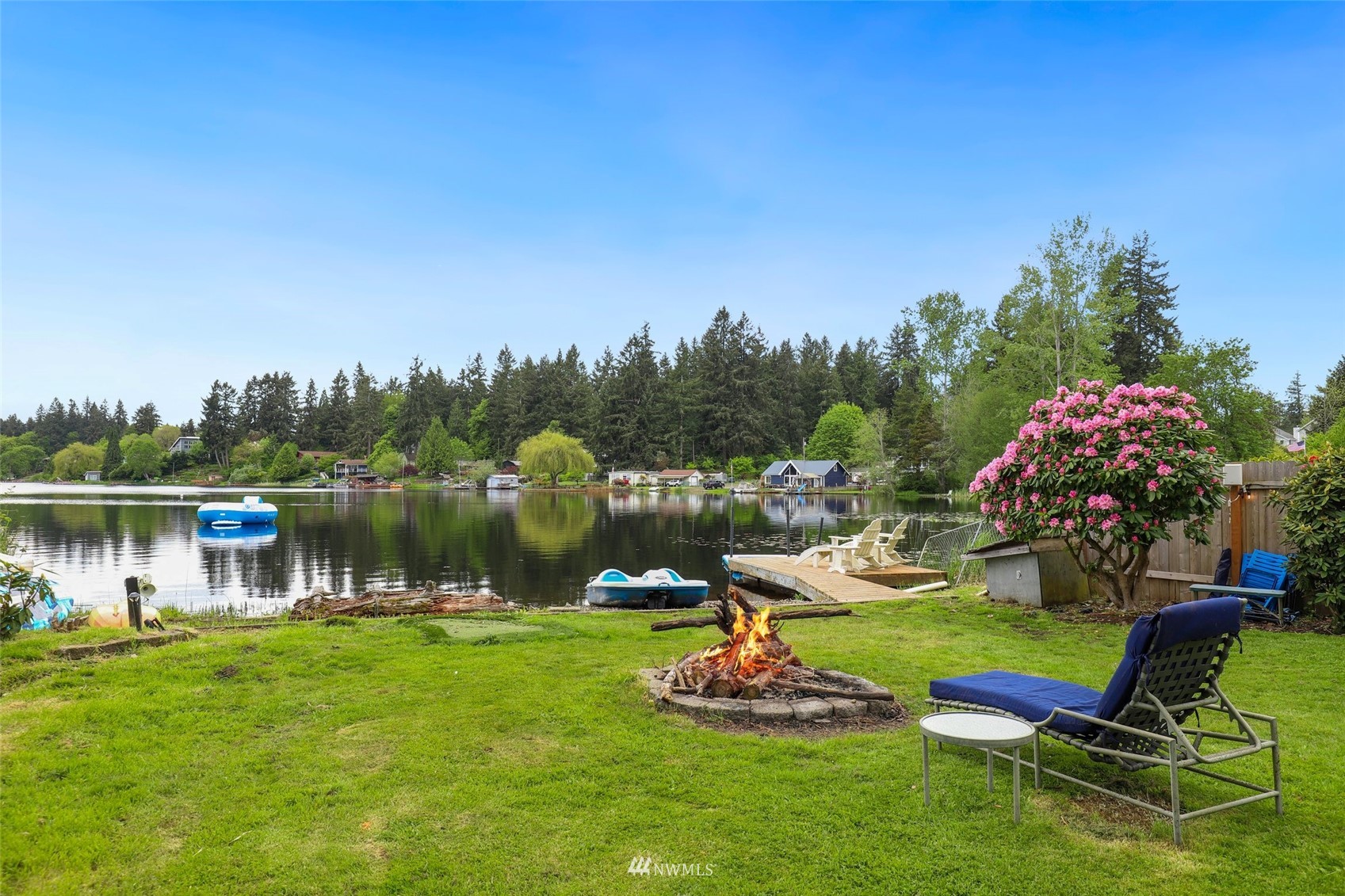7031 Mullen Road Southeast Olympia, WA 98503 - Photo 38 of 40 a view of a lake with a yard and a fountain