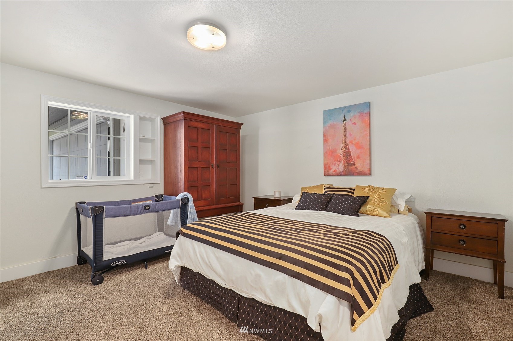 7031 Mullen Road Southeast Olympia, WA 98503 - Photo 5 of 40 a bedroom with a bed and a couch