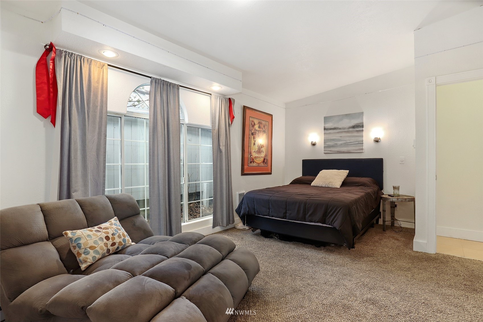 7031 Mullen Road Southeast Olympia, WA 98503 - Photo 8 of 40 a spacious bedroom with a bed window and couch