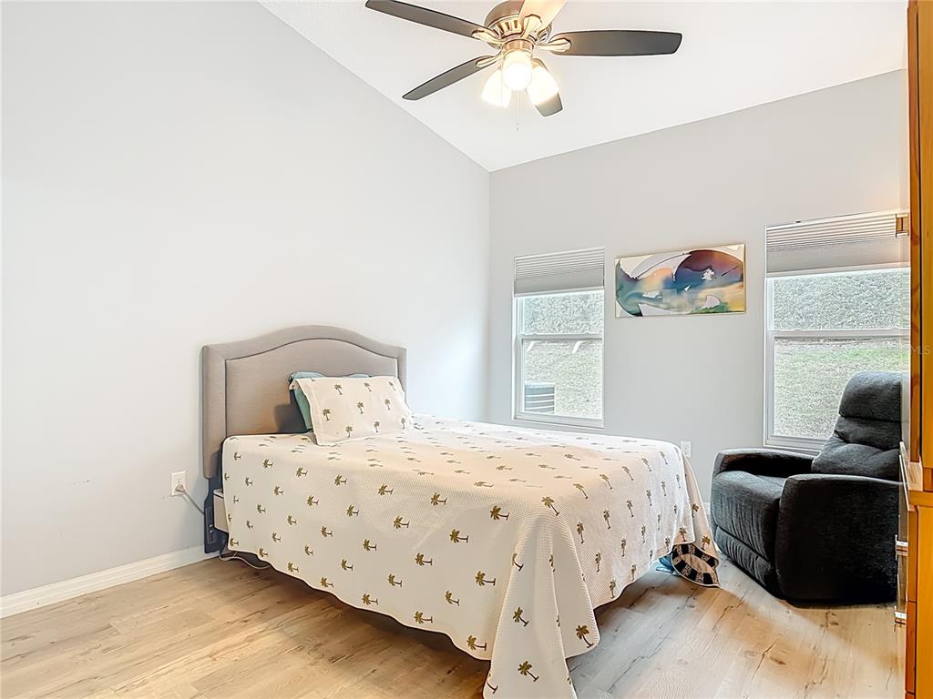 202 Walter Stevens Way DeLand, FL 32724 - Photo 17 of 34 a bedroom with a bed and window