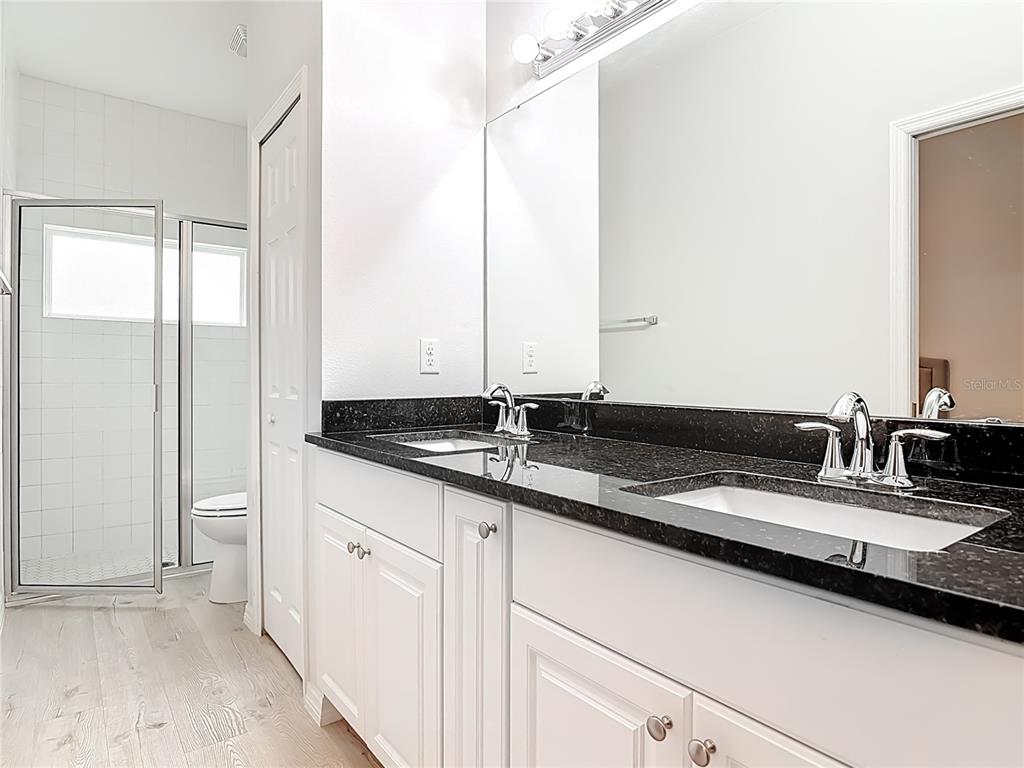 202 Walter Stevens Way DeLand, FL 32724 - Photo 19 of 34 a close view of sink and mirror