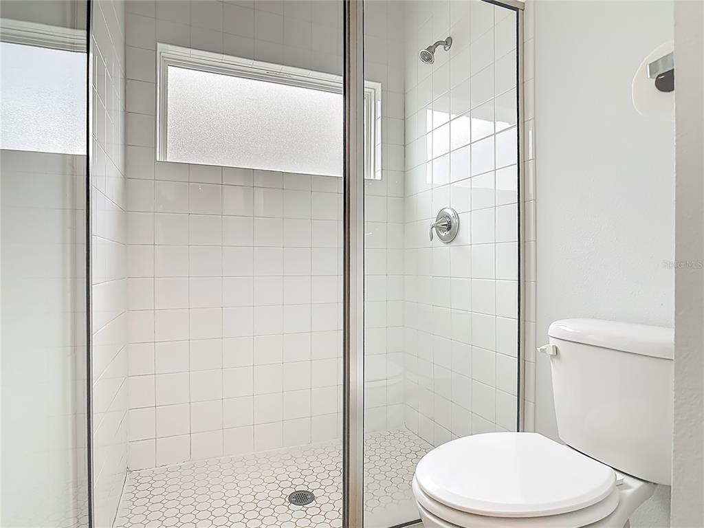 202 Walter Stevens Way DeLand, FL 32724 - Photo 20 of 34 a white toilet sitting next to a bathroom sink