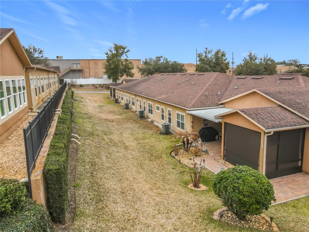 202 Walter Stevens Way DeLand, FL 32724 - Photo 32 of 34 a aerial view of a house with swimming pool and sitting area