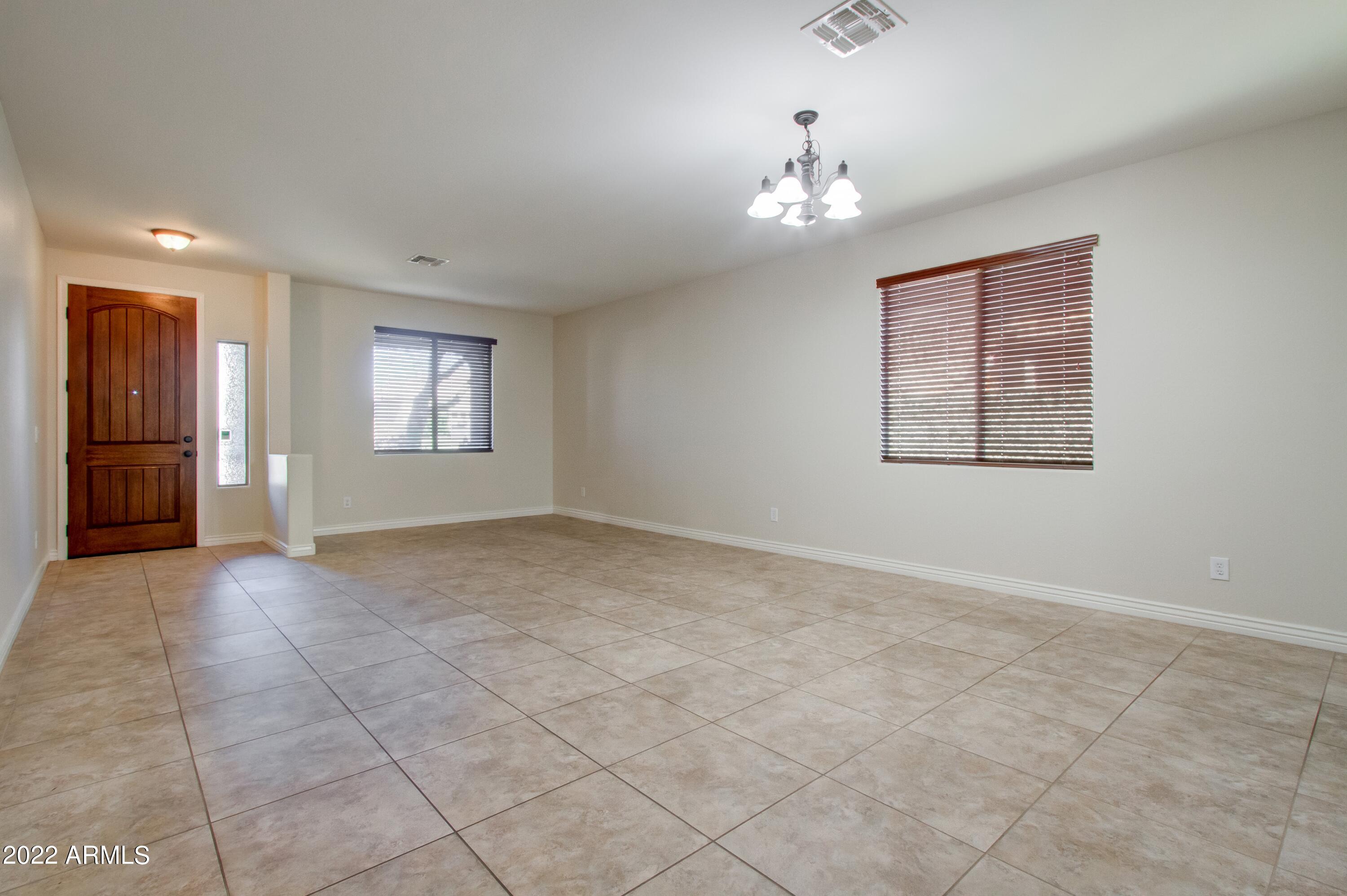 4241 East Folgers Road Phoenix, AZ 85050 - Photo 4 of 30 004_Formal Dining and Living Room