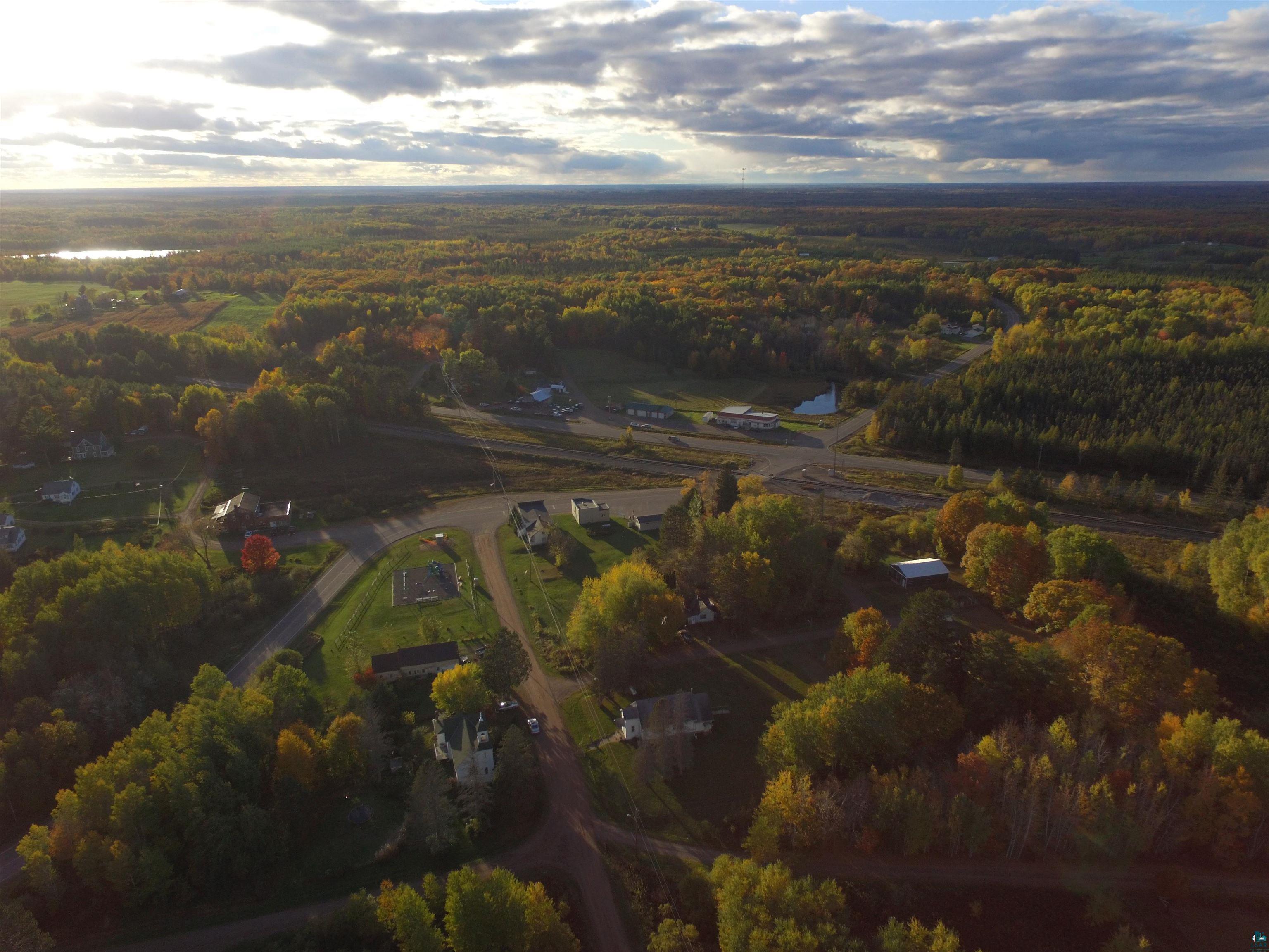8372 Garden Street Kerrick, MN 55756 - Photo 13 of 24 Aerial view of property and surrounding area with a heavily wooded area