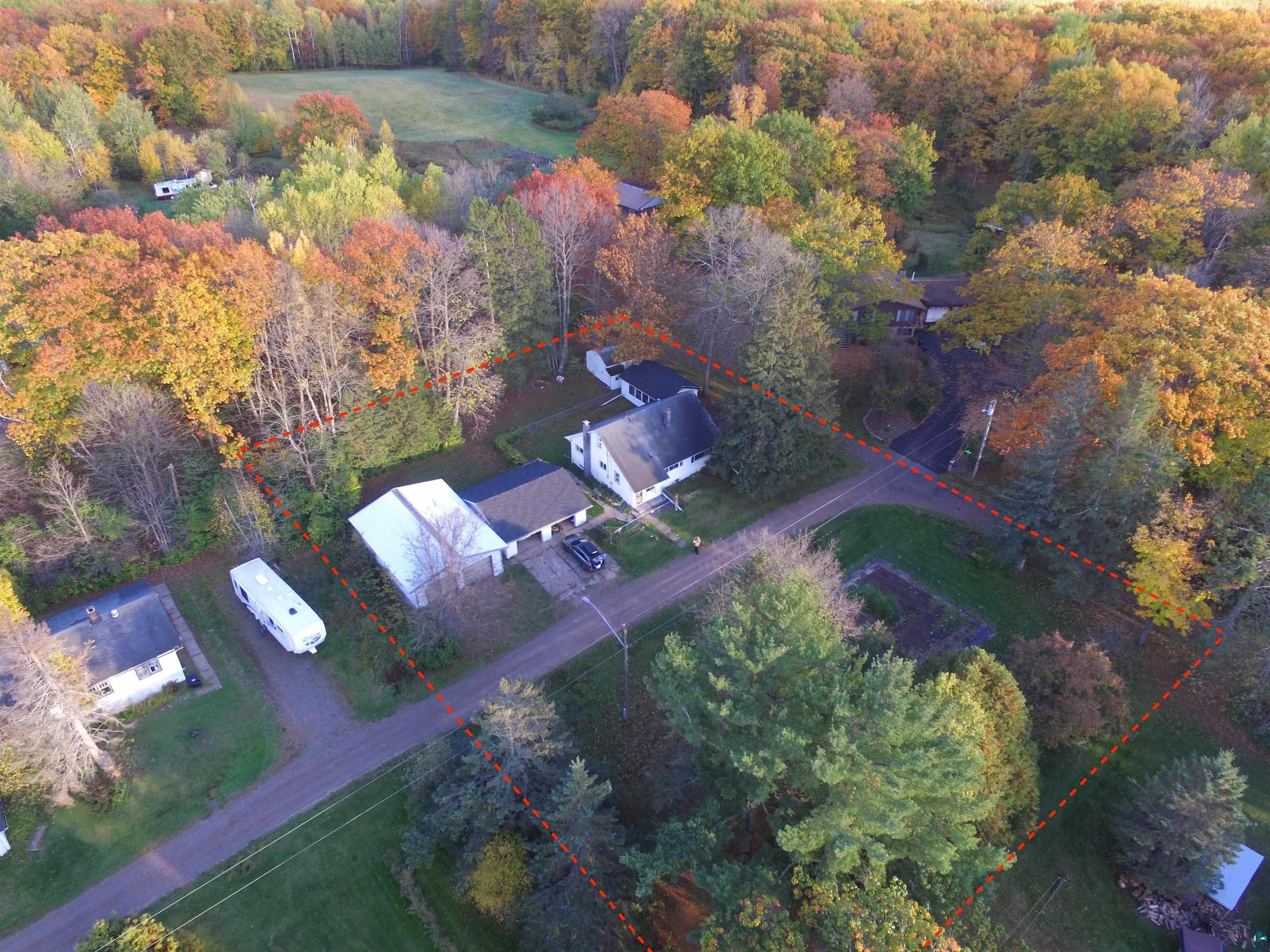8372 Garden Street Kerrick, MN 55756 - Photo 14 of 24 Aerial view of property and surrounding area featuring property parcel outlined and a forest