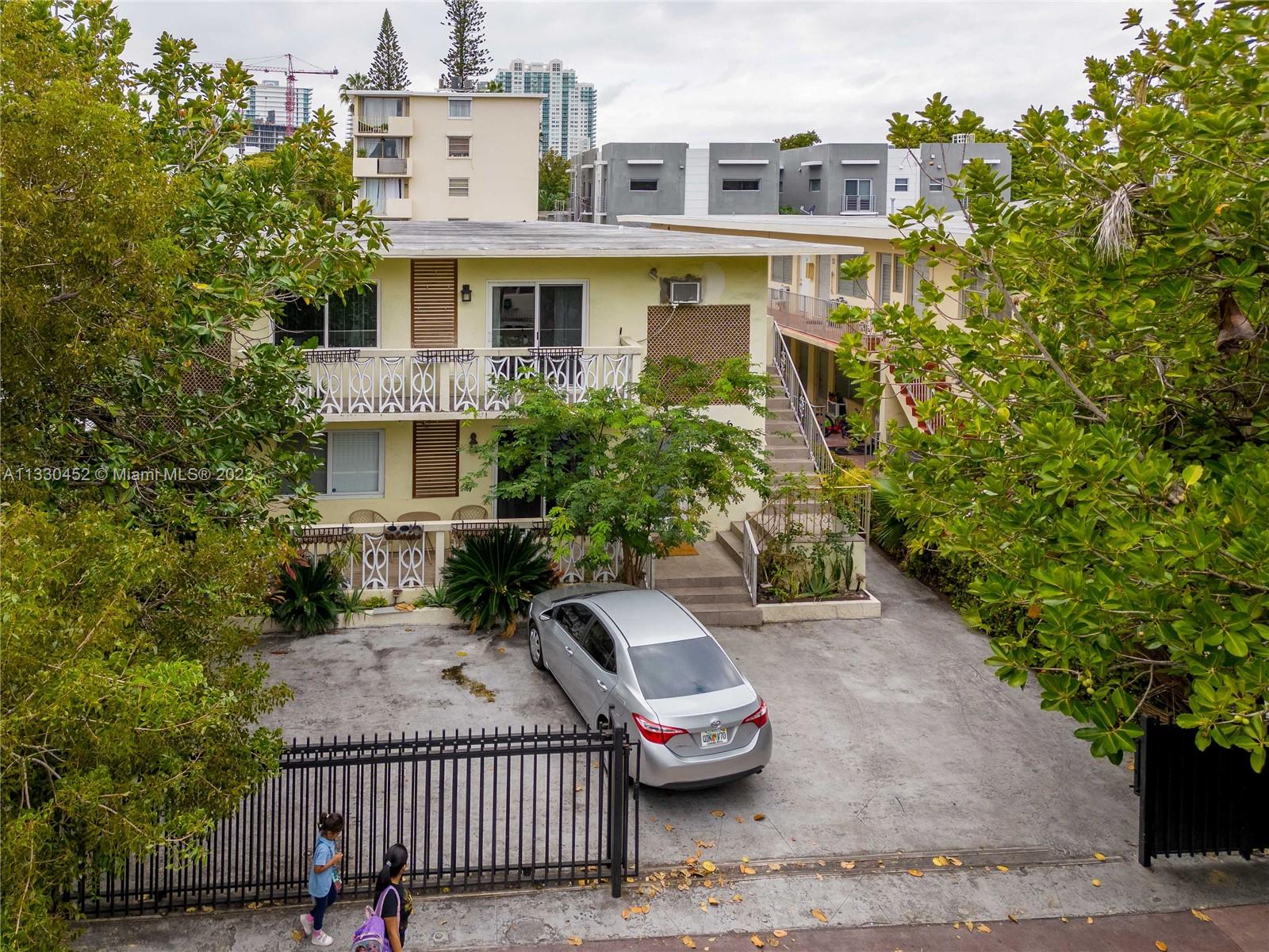 626 Meridian Avenue, Unit 12 Miami Beach, FL 33139 - Photo 1 of 10 a front view of a house with a yard
