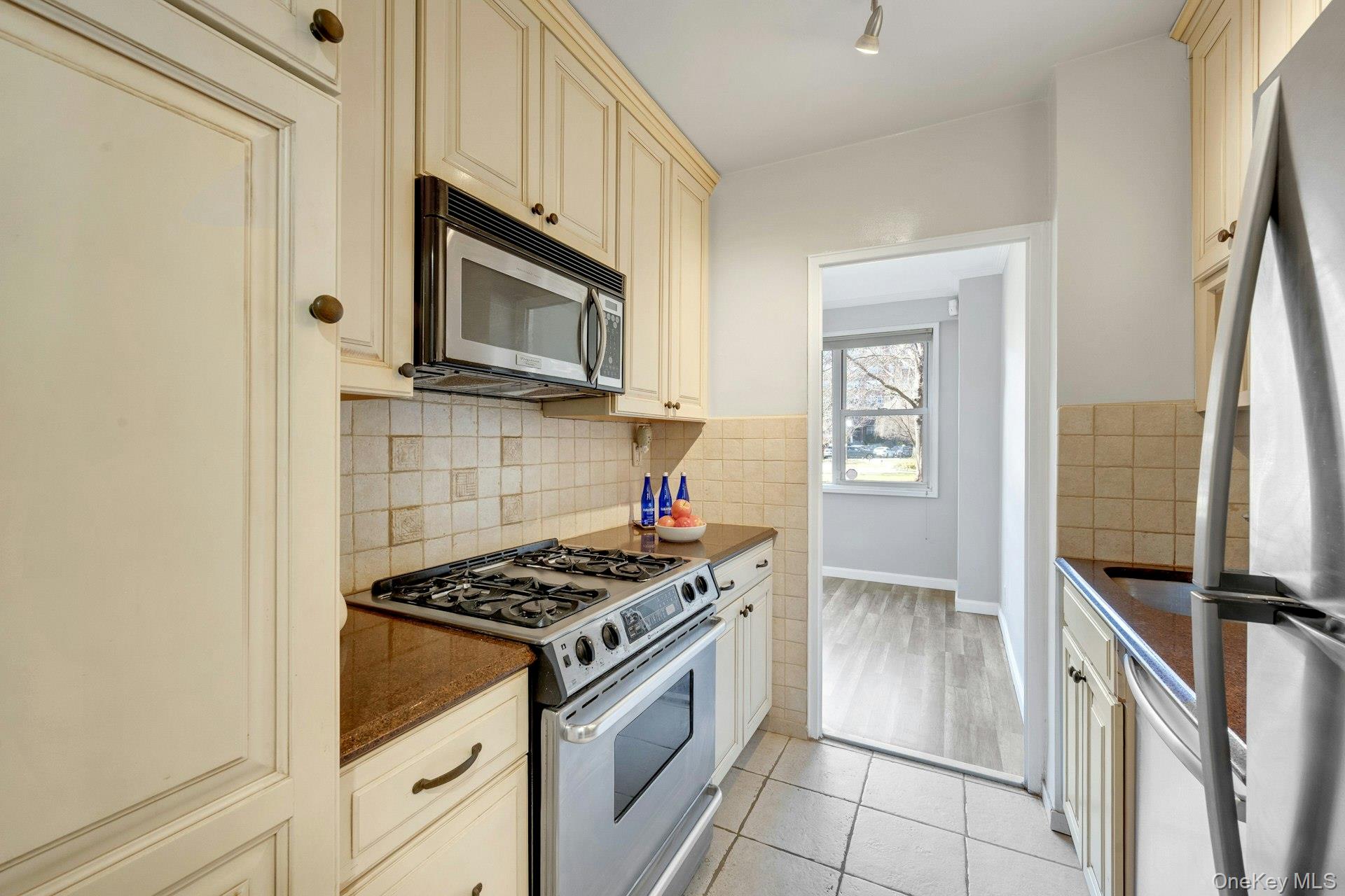 240 Garth Road, Unit 2G2 Scarsdale, NY 10583 - Photo 12 of 25 Kitchen with stainless steel appliances